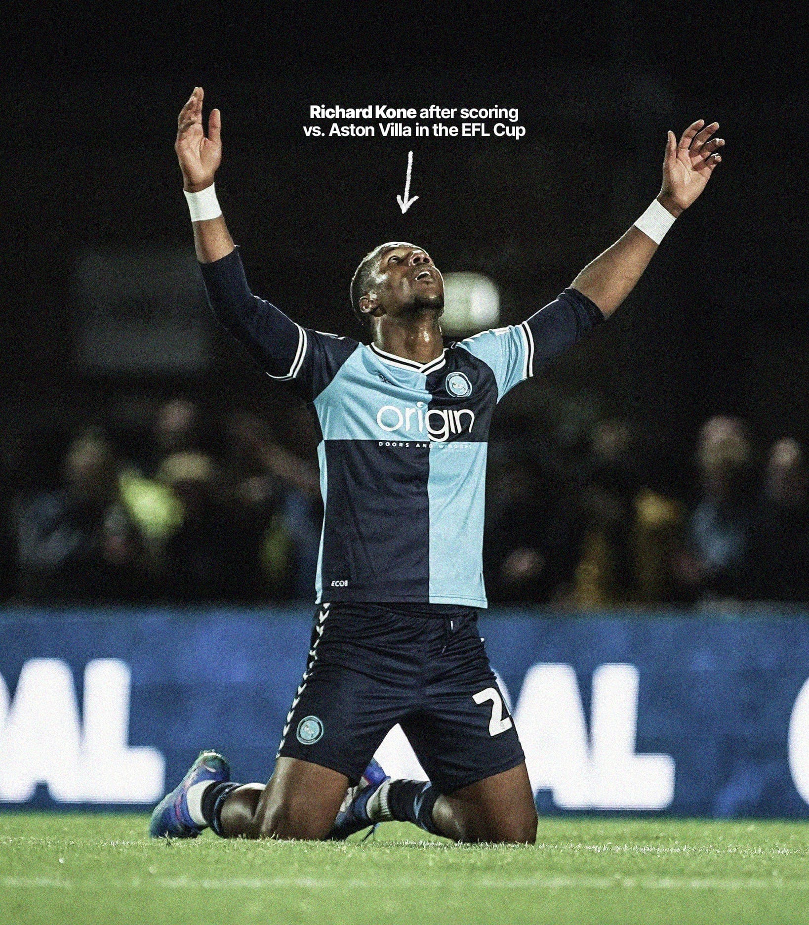 A photo of Richard Kone on his knees, pointing to the sky, celebrating scoring against Aston Villa in the EFL Cup