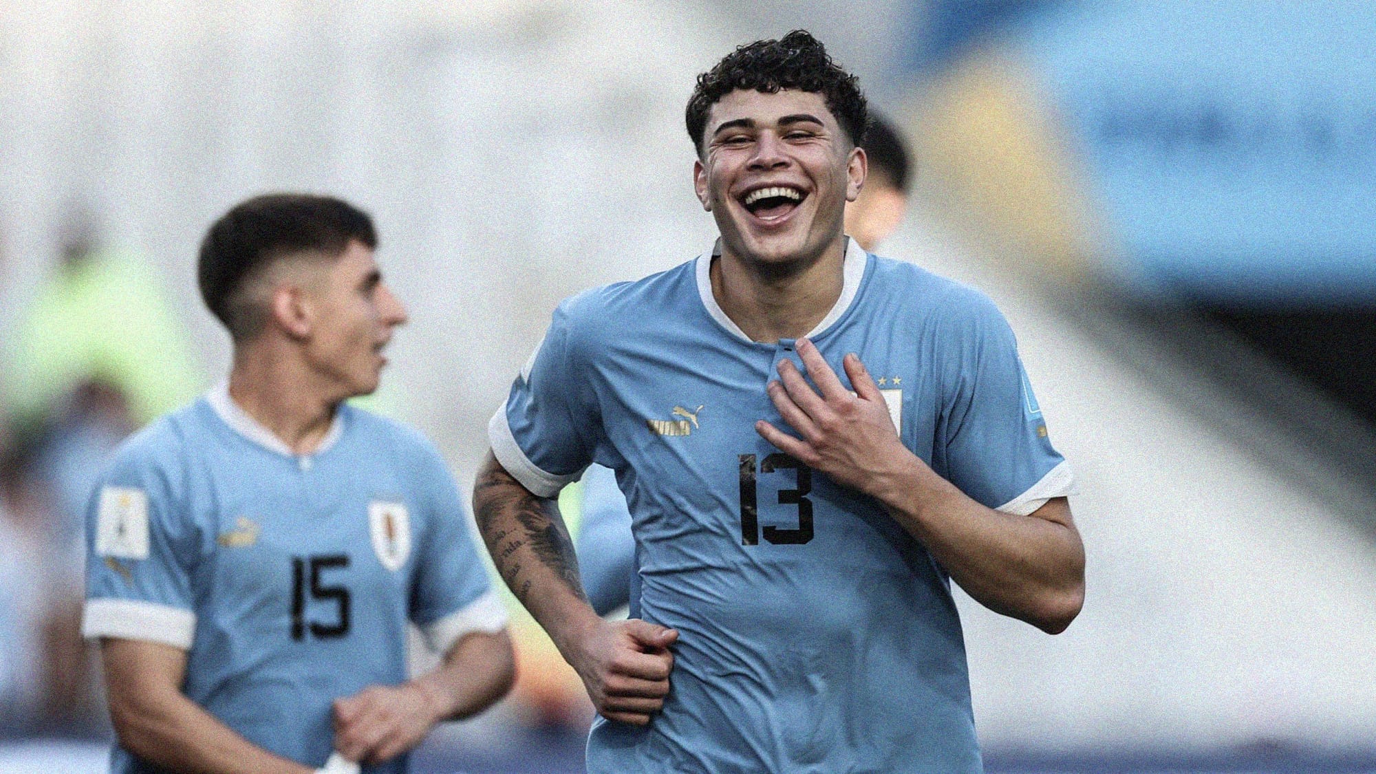 A photo of Uruguay's Alan Matturro smiling and laughing at the 2023 FIFA U-20 World Cup