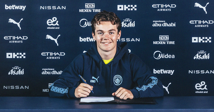 Sverre Nypan signing a contract at Manchester City