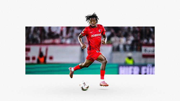 Johan Manzambi running with the ball for Freiburg, wearing an all-red kit