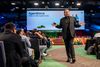 Salesforce CEO Marc Benioff walks among attendees at Dreamforce 2024 in a black suit.