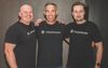  Clickhouse co-founders Yury Izrailevsky, Aaron Katz, and Alexey Milovidov pose wearing black t-shirts with the company's logo.