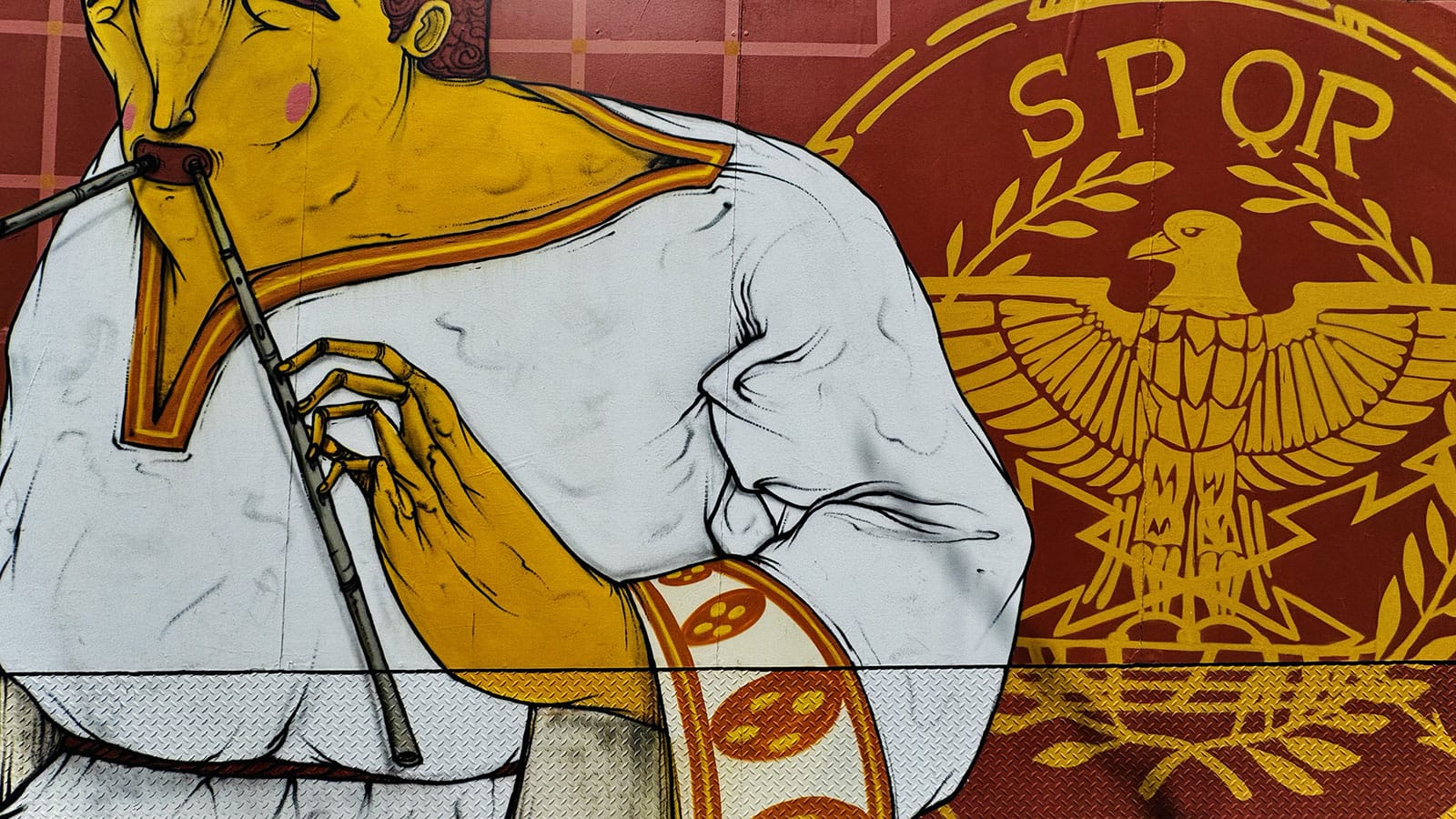 Graffiti on top of the Roman theater in Lisbon, behind the wires that protect the monument.