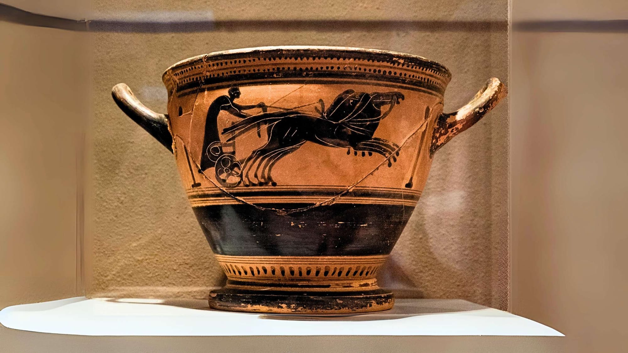 Chariot races were also famous in Ancient Greece. Charioteer portrayed in full agonist action driving a chariot drawn by four horses.