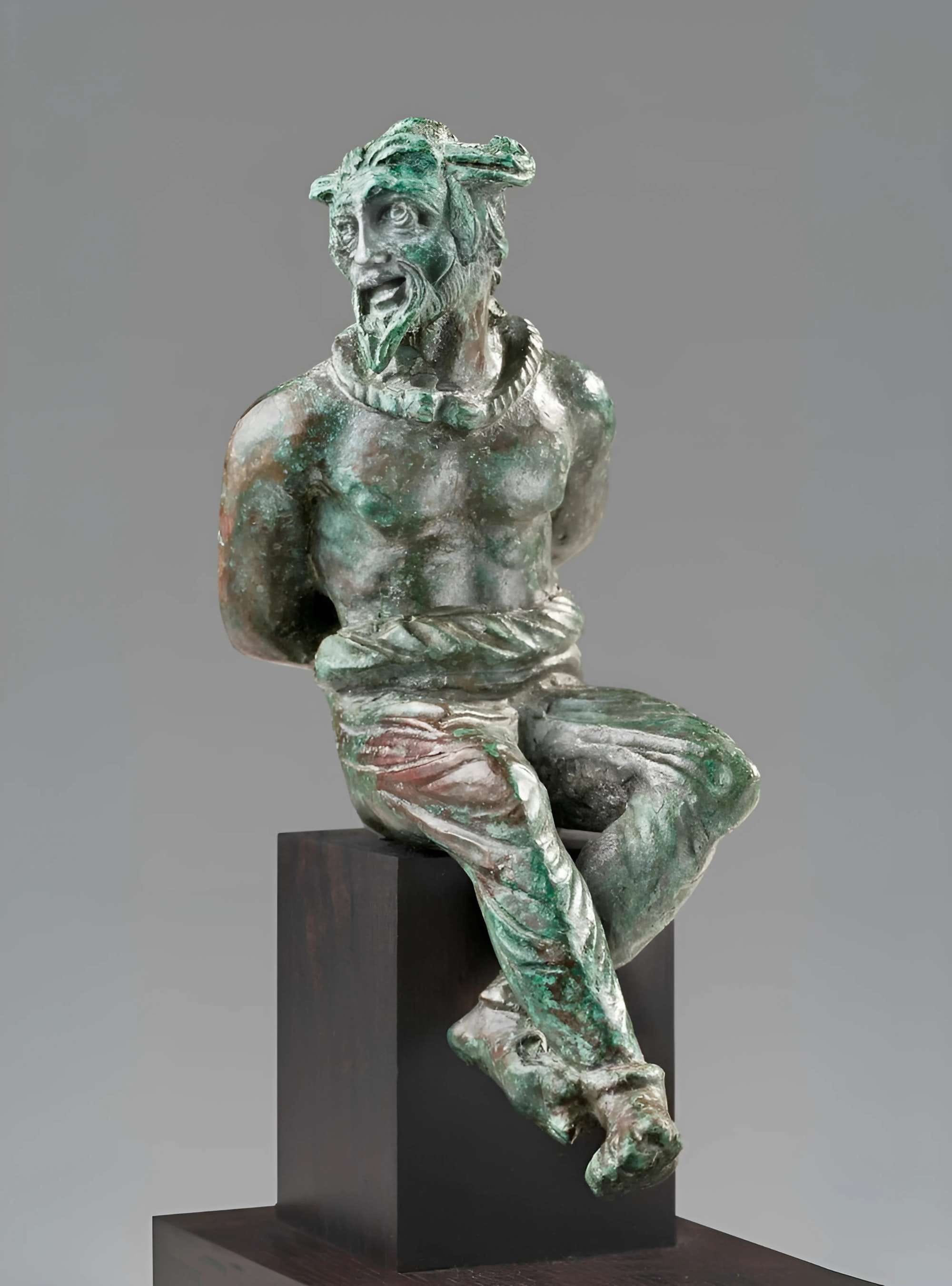 A Roman Bronze Statuette of a Captive Gaul
