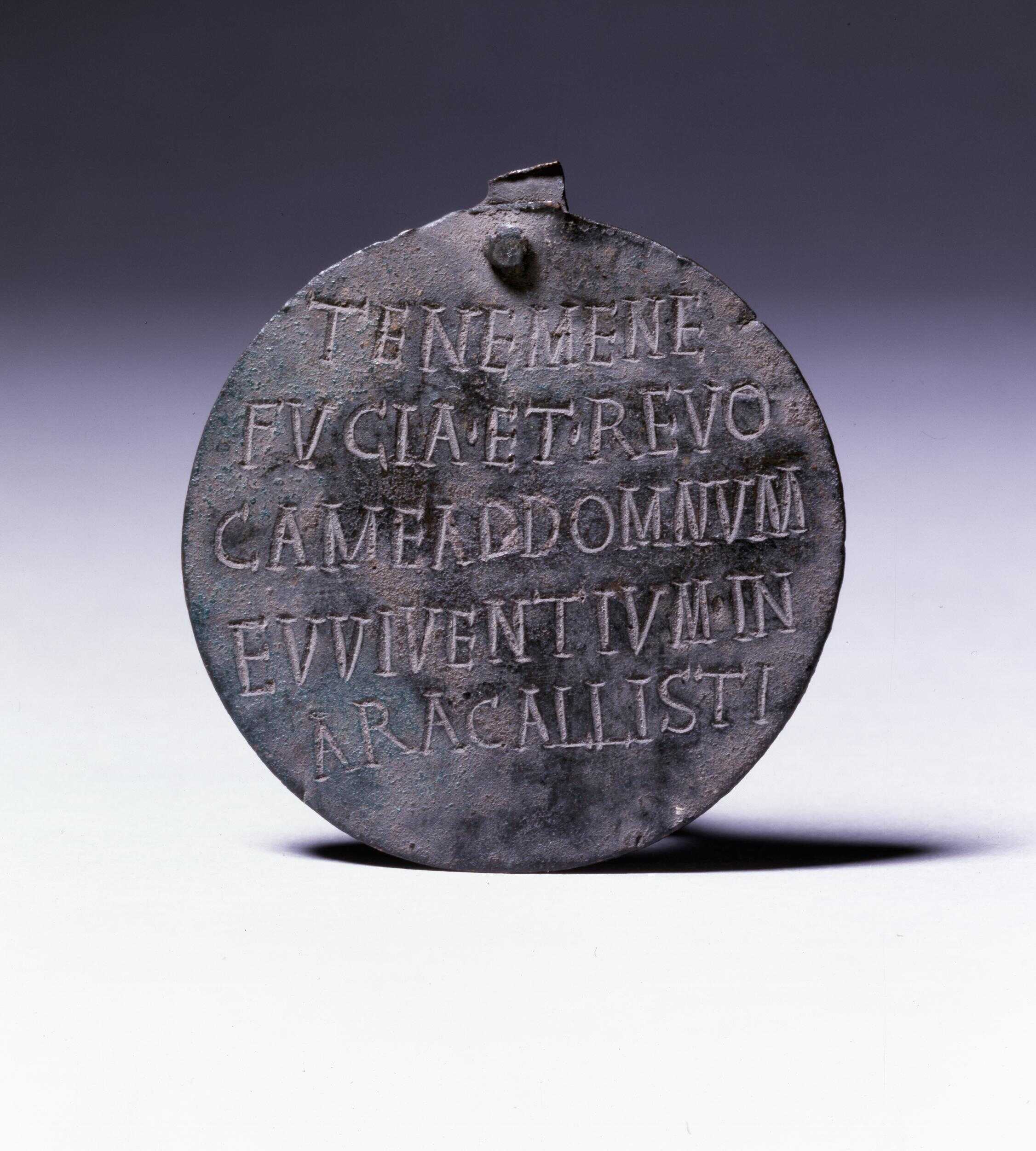 A Roman slave collar, from the British Museum collection, reading: “Hold me, lest I flee, and return me to my master Viventius on the estate of Callistus”