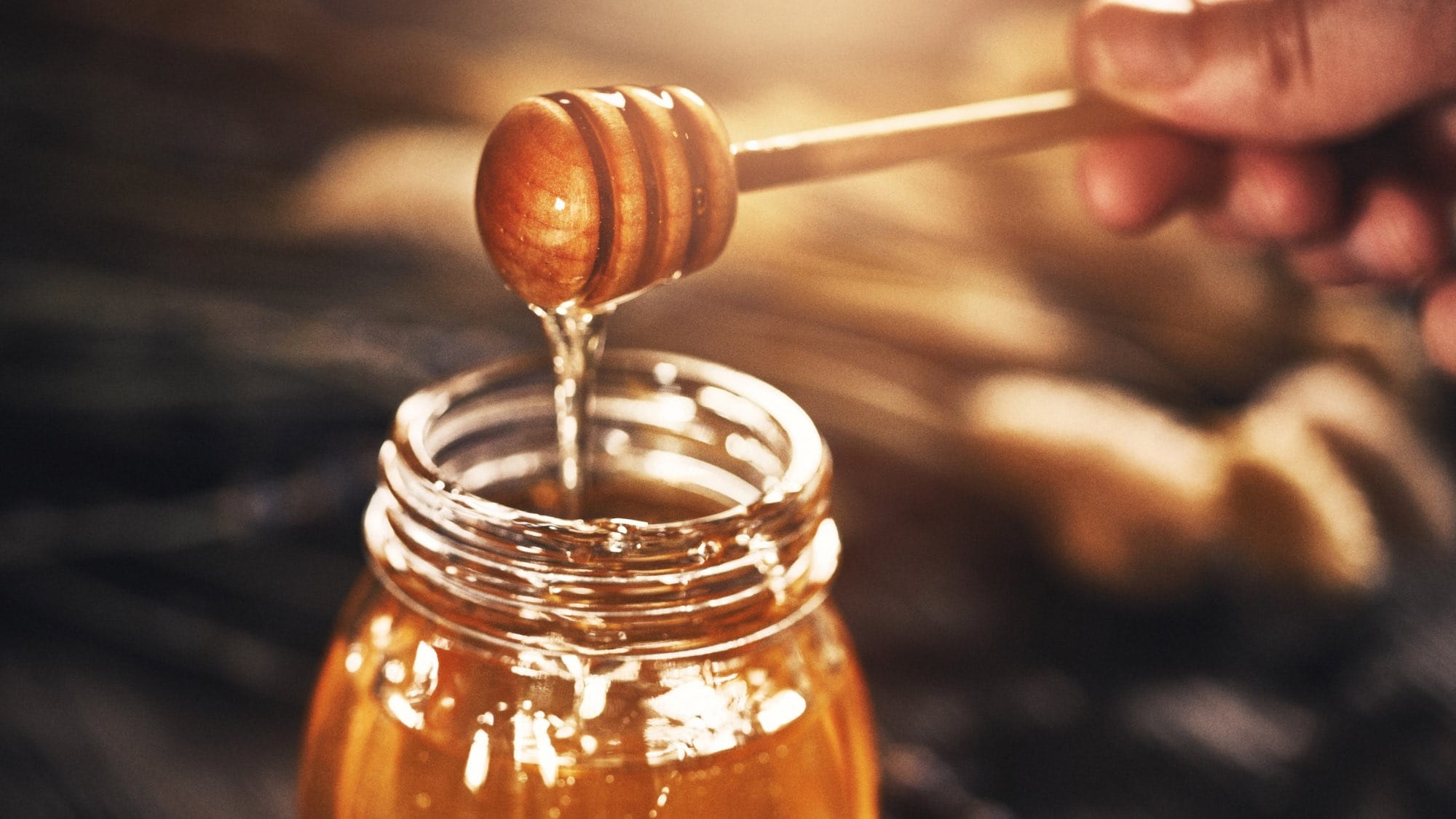There is a significant usage of honey in De Re Coquinaria, image of a jar of organic honey
