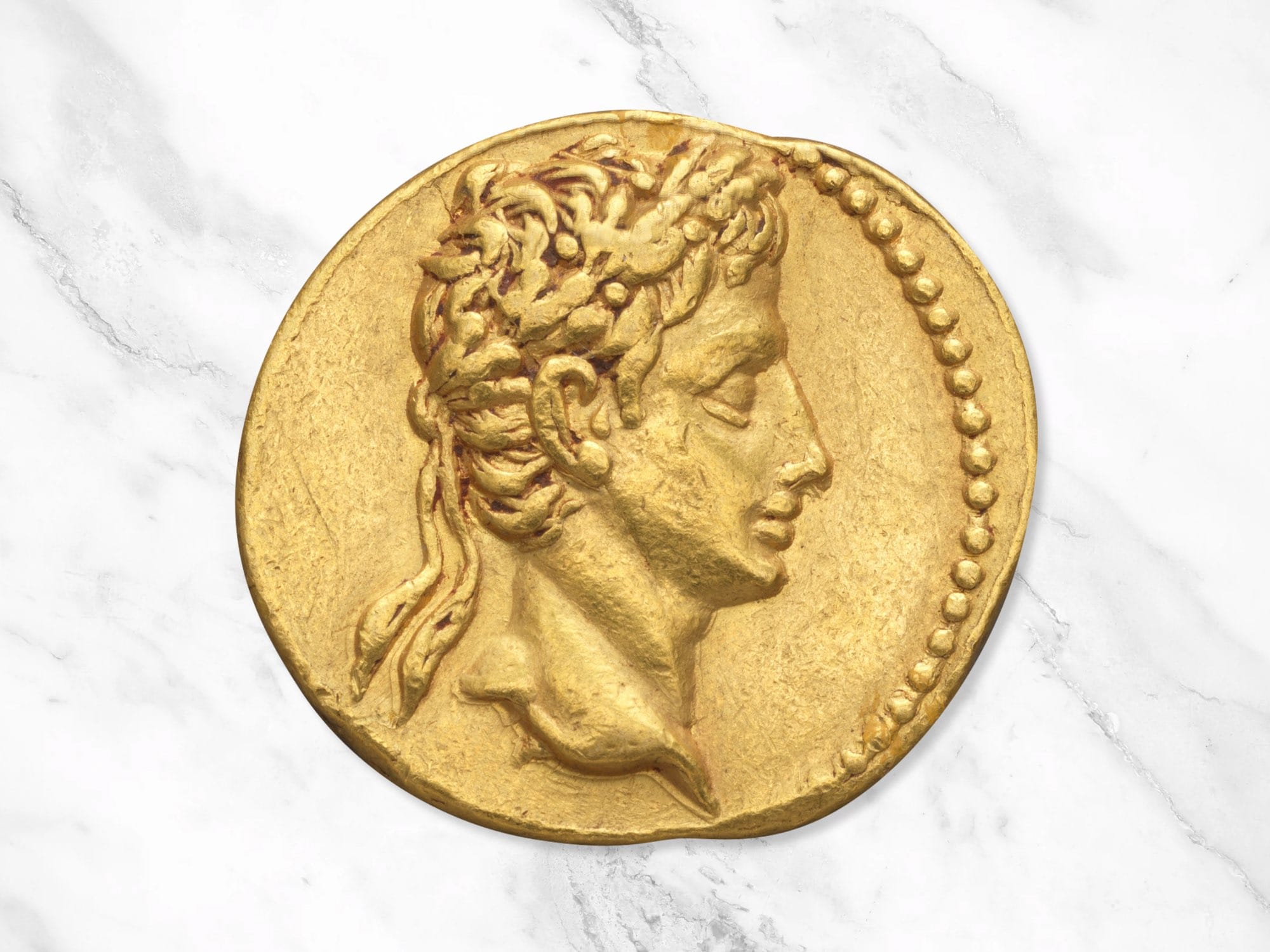 A golden Roman aureus coin, depicting Emperor Augustus by Unknown, -19