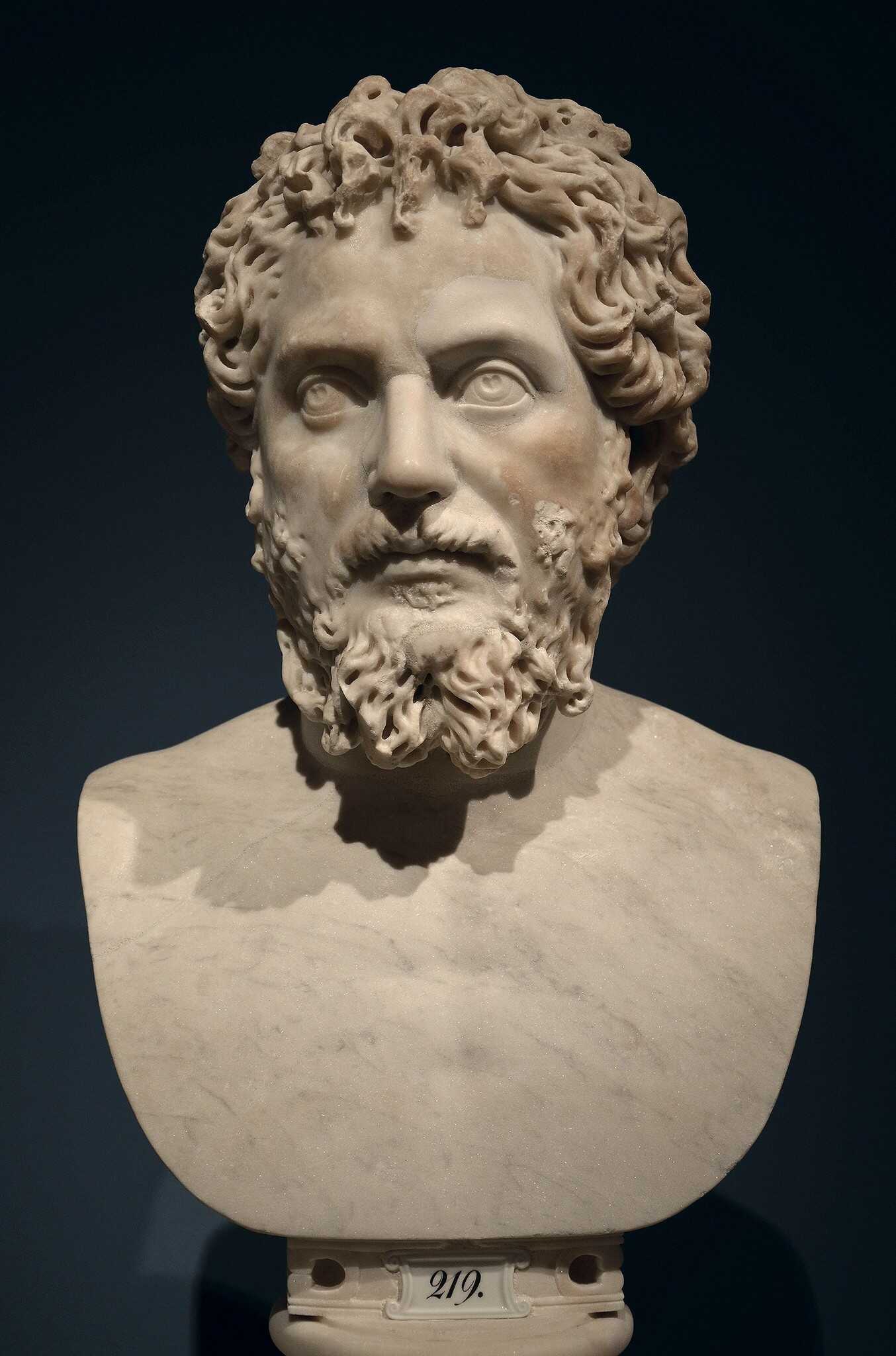 Septimius Severus in the classic style of four "Serapis curls" falling into his forehead, that go back to a cult image of the Egyptian god Serapis, to whom the North African Emperor felt particularly attached