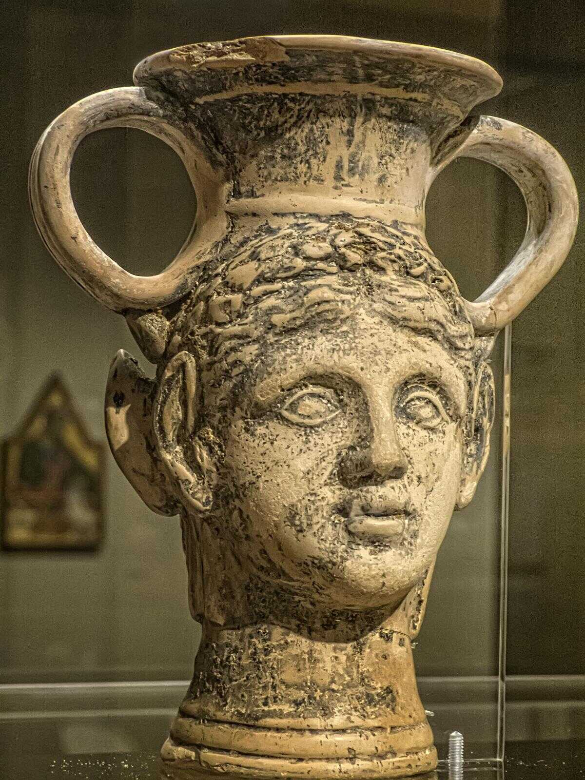 A Kantharos (wine vessel) with satyr and maenad heads Roman Britain 1st century CE Ceramic with pigment
