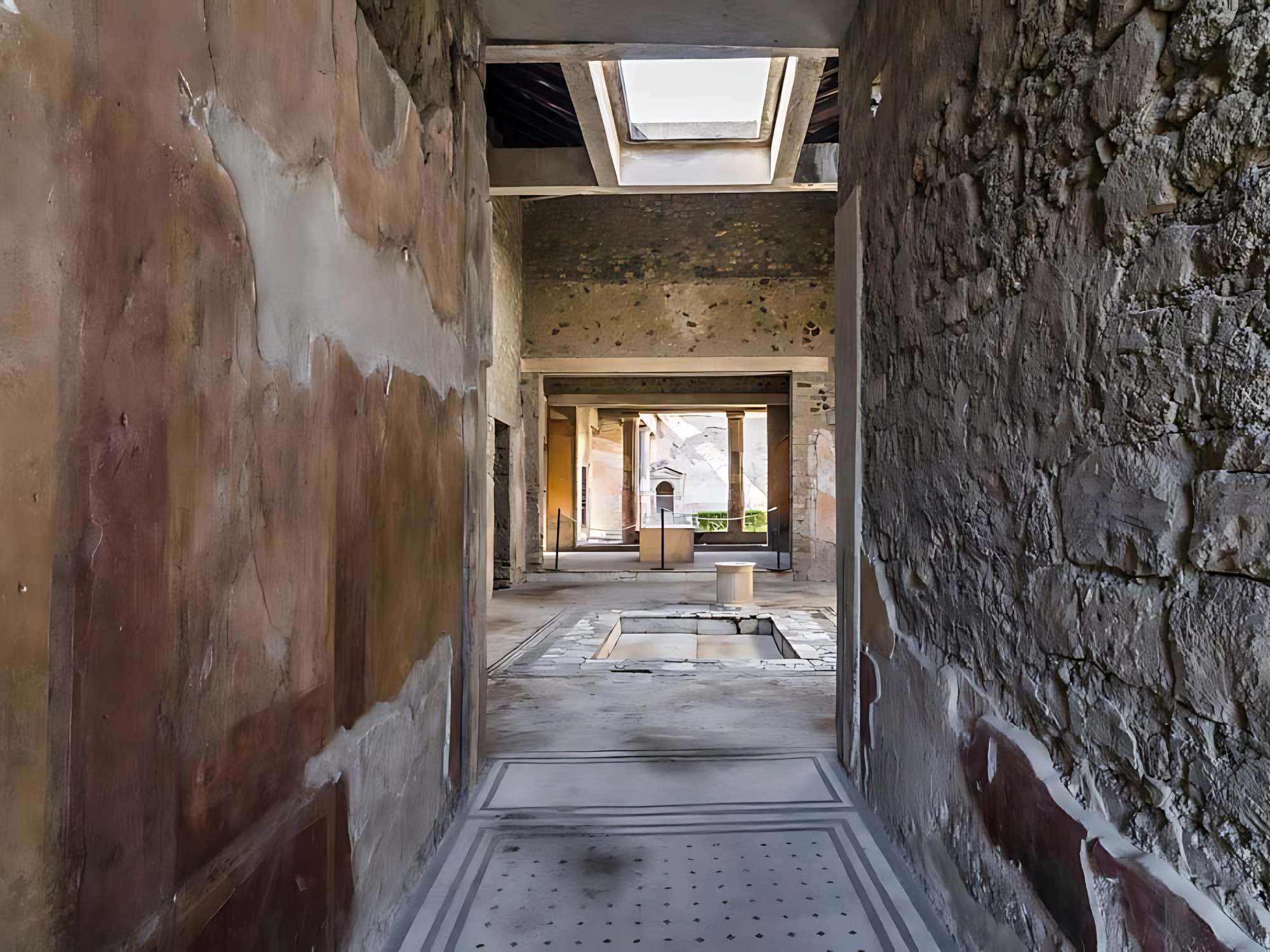 House of the tragic Poet- Pompeii. Looking north along entrance corridor across atrium towards peristyle with lararium