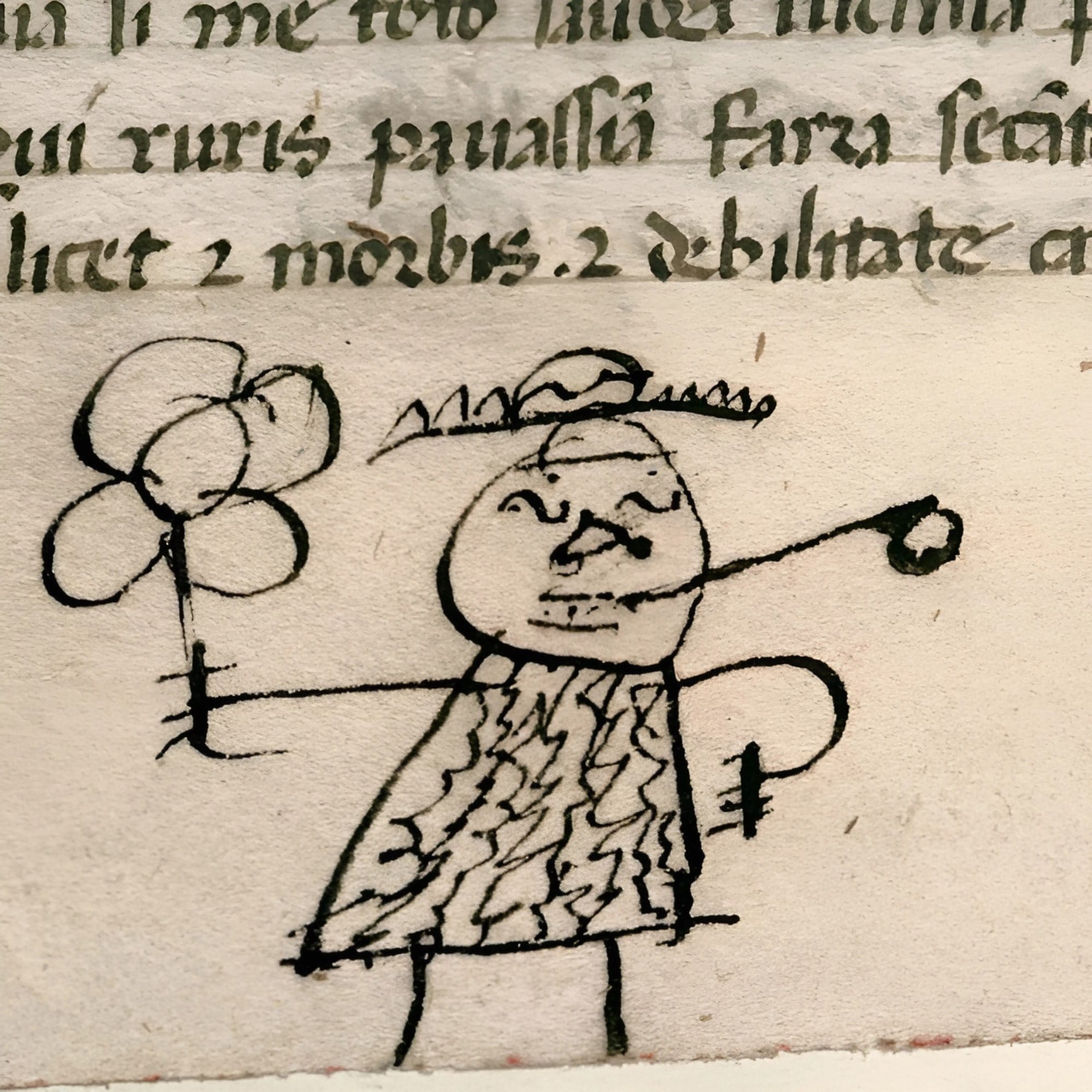 Doodle by bored medieval school boy, a 15th-century doodle in the lower margin of a manuscript containing Juvenal’s Satires, a popular classical text used to teach young children about morals