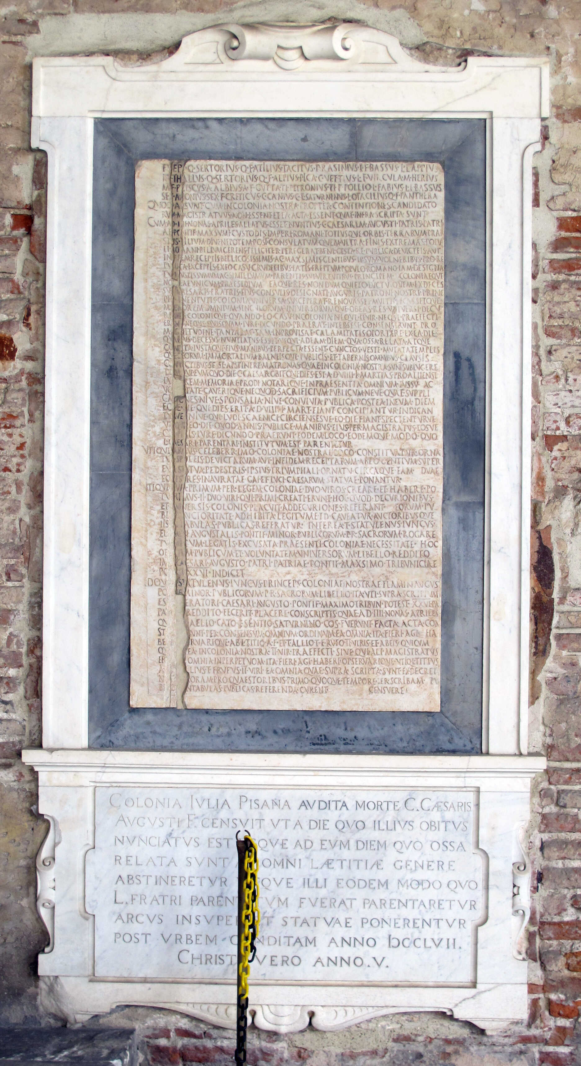 An inscription found in Campo Santo in Pisa, on the south side, showing the decrees of Iulia Pisana for the funeral honours of the adopted children of Augustus, Caius and Lucius Ceasar