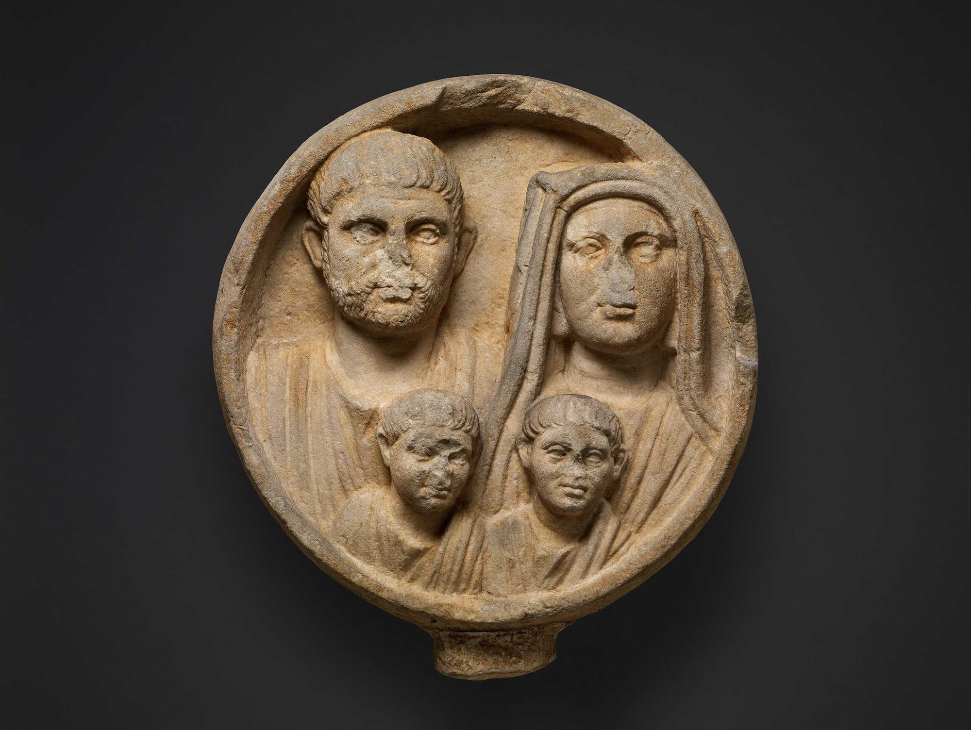Marble funerary relief of a Roman family