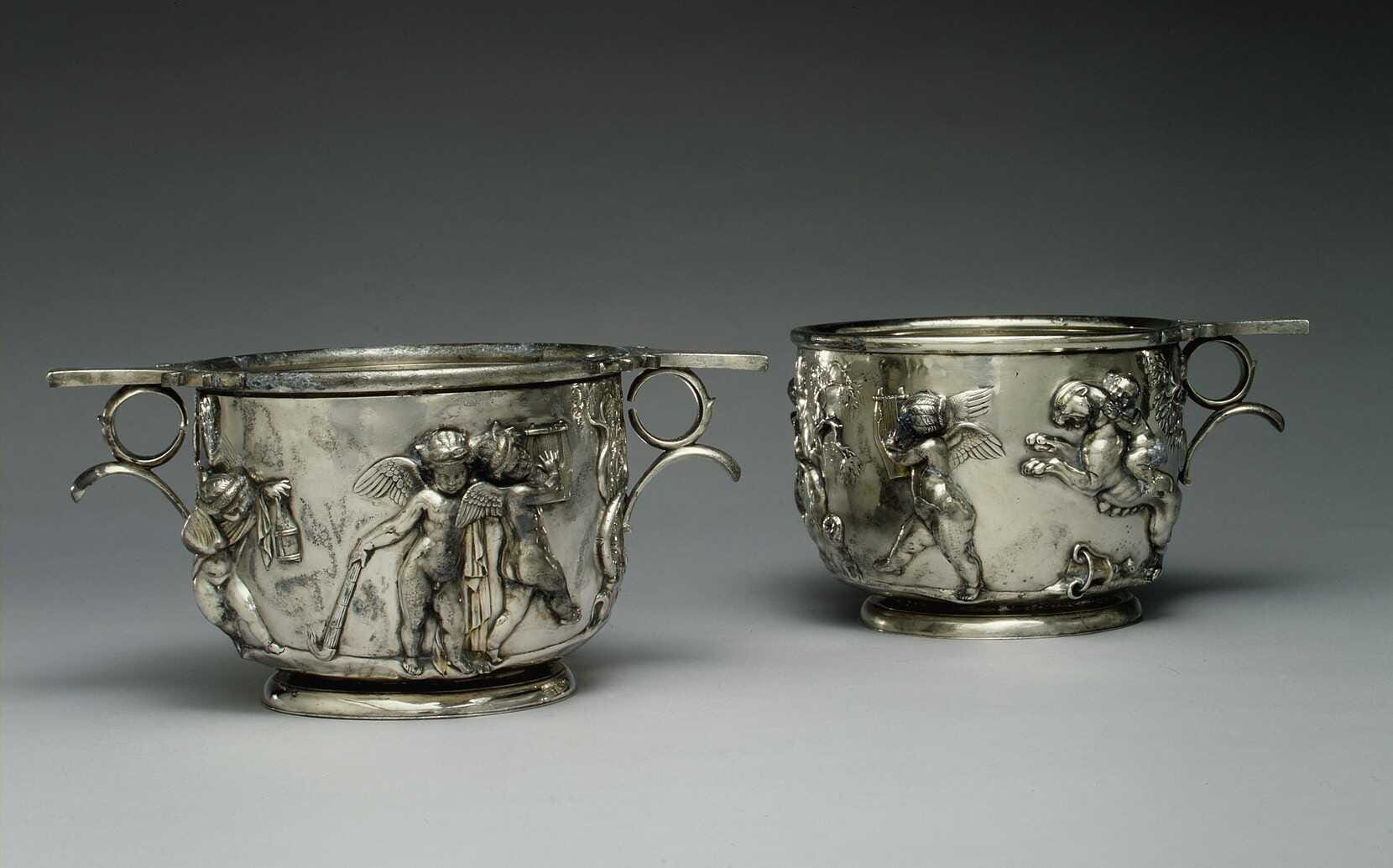 Pair of Roman silver cups (scyphi) with relief decoration