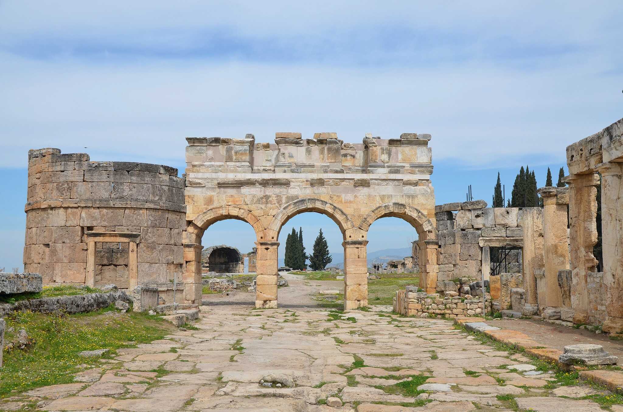 The Frontinus Gate, the monumental entrance to the Roman city flanked by two round towers, on the basis of a dedication to Domitian on the gate's facade, in the Ancient Greek city of Hierapolis, in modern Turkey