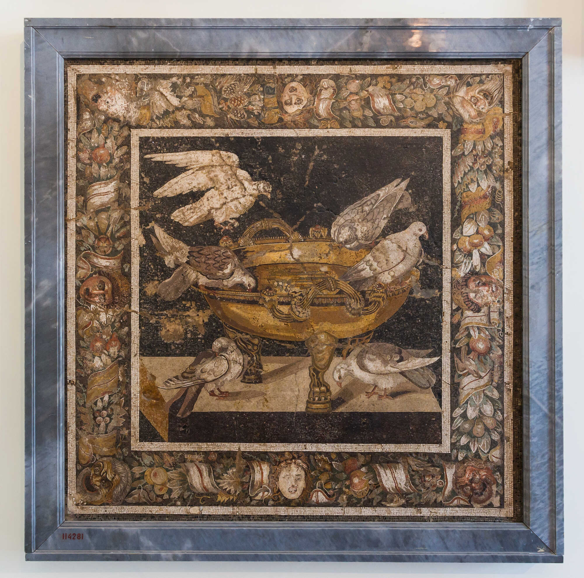 Ancient roman mosaic from Pompeii (House of the Doves), depicting birds drinking water. Public domain