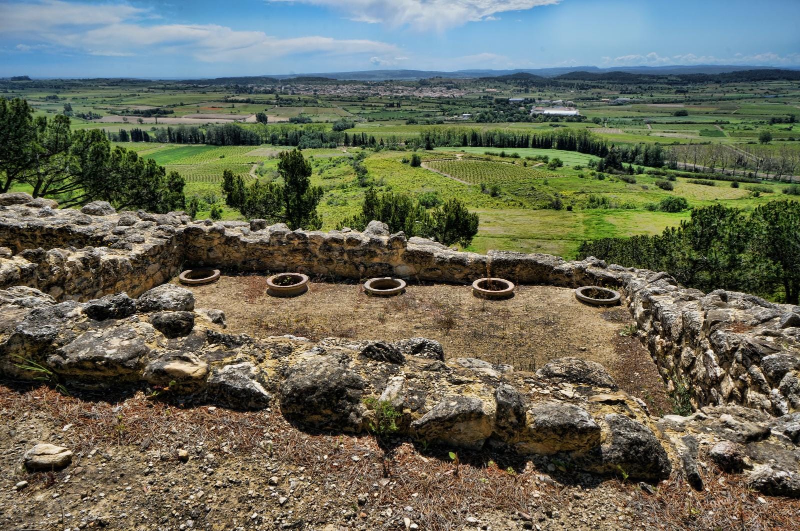 Embedded earthenware dolia (storage jars) at the Oppidum d'Ensérune in southern France