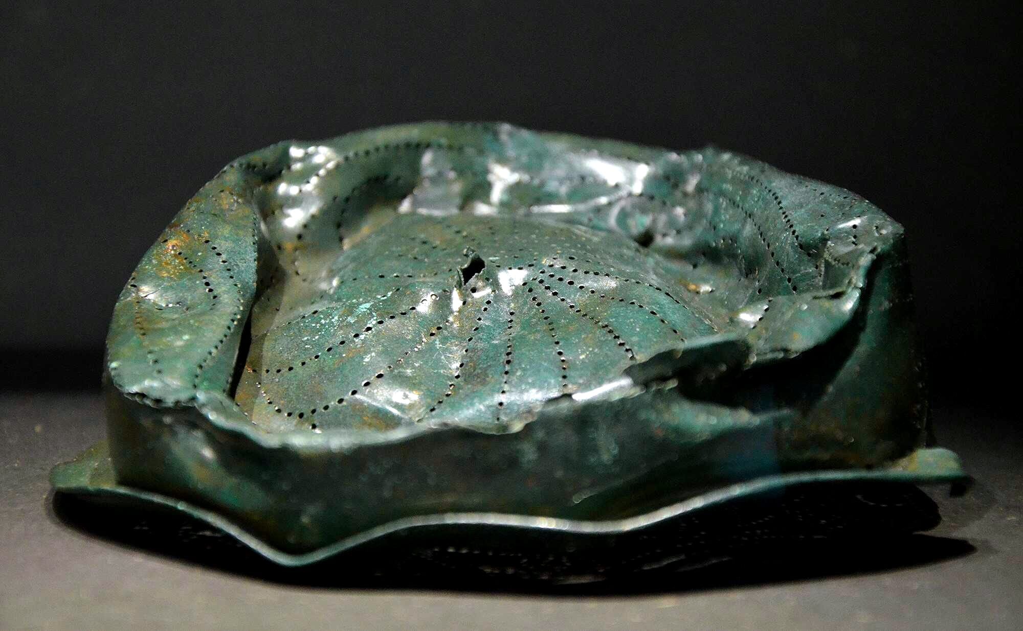 Damaged wine strainer made of bronze found on the site of the Battle of Teutoburg Forest, Museum und Park Kalkriese, Germany