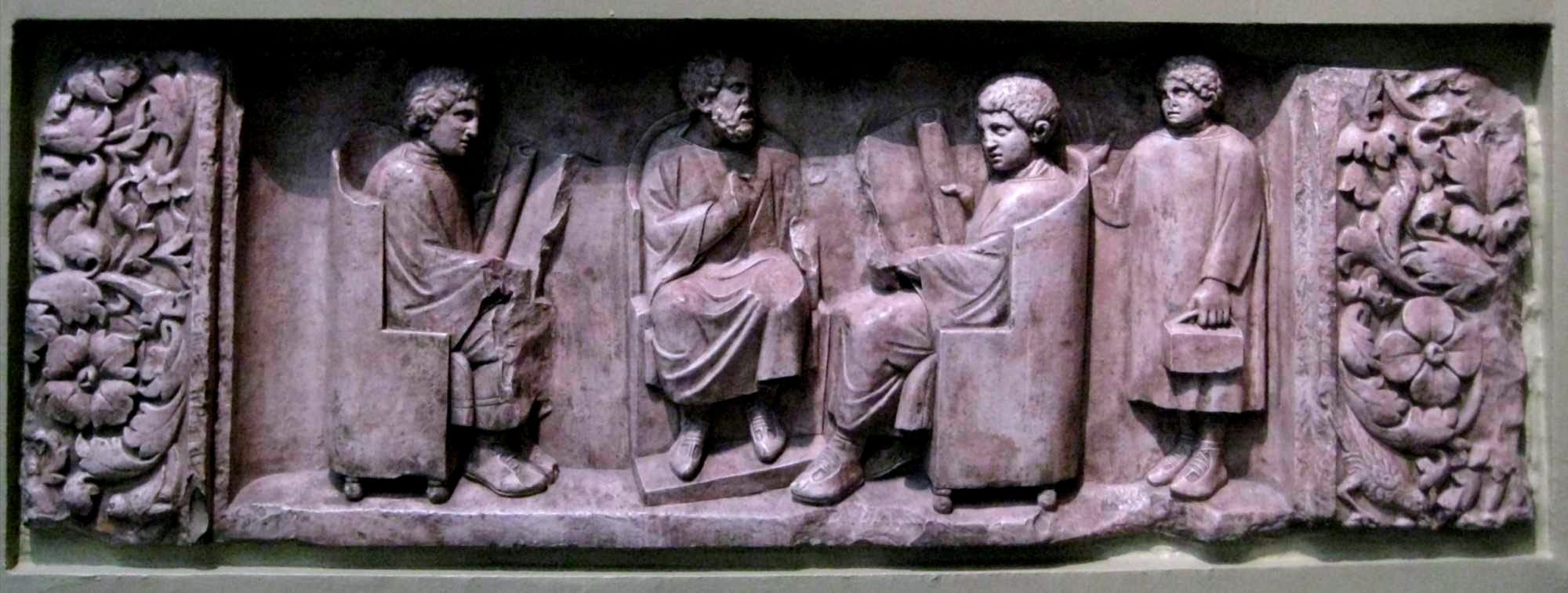  Relief found in Neumagen near Trier, a teacher with three discipuli. Around 180–185 CE. Photo of casting in Pushkin museum, Moscow.