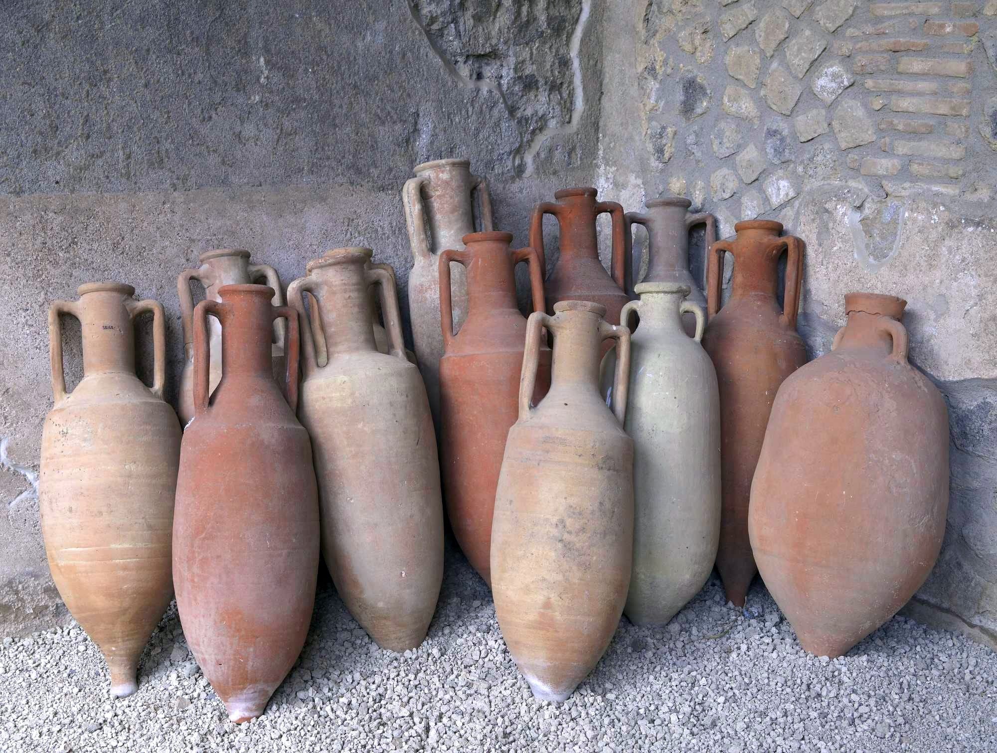 Ancient Roman amphoras in Pompeii, in the Peristyle of the Casa della Nave Europa