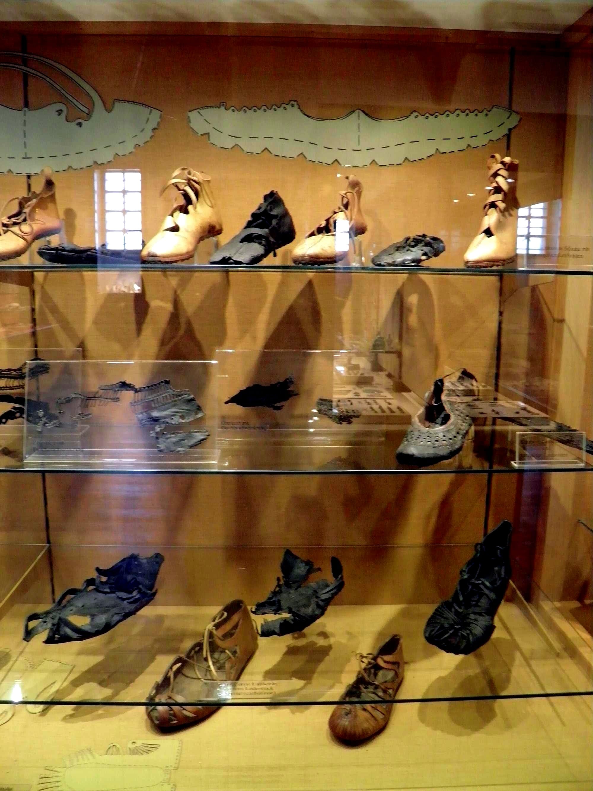 Some amazingly preserved roman shoes; the black ones are the originals, and the brown ones the modern copies.