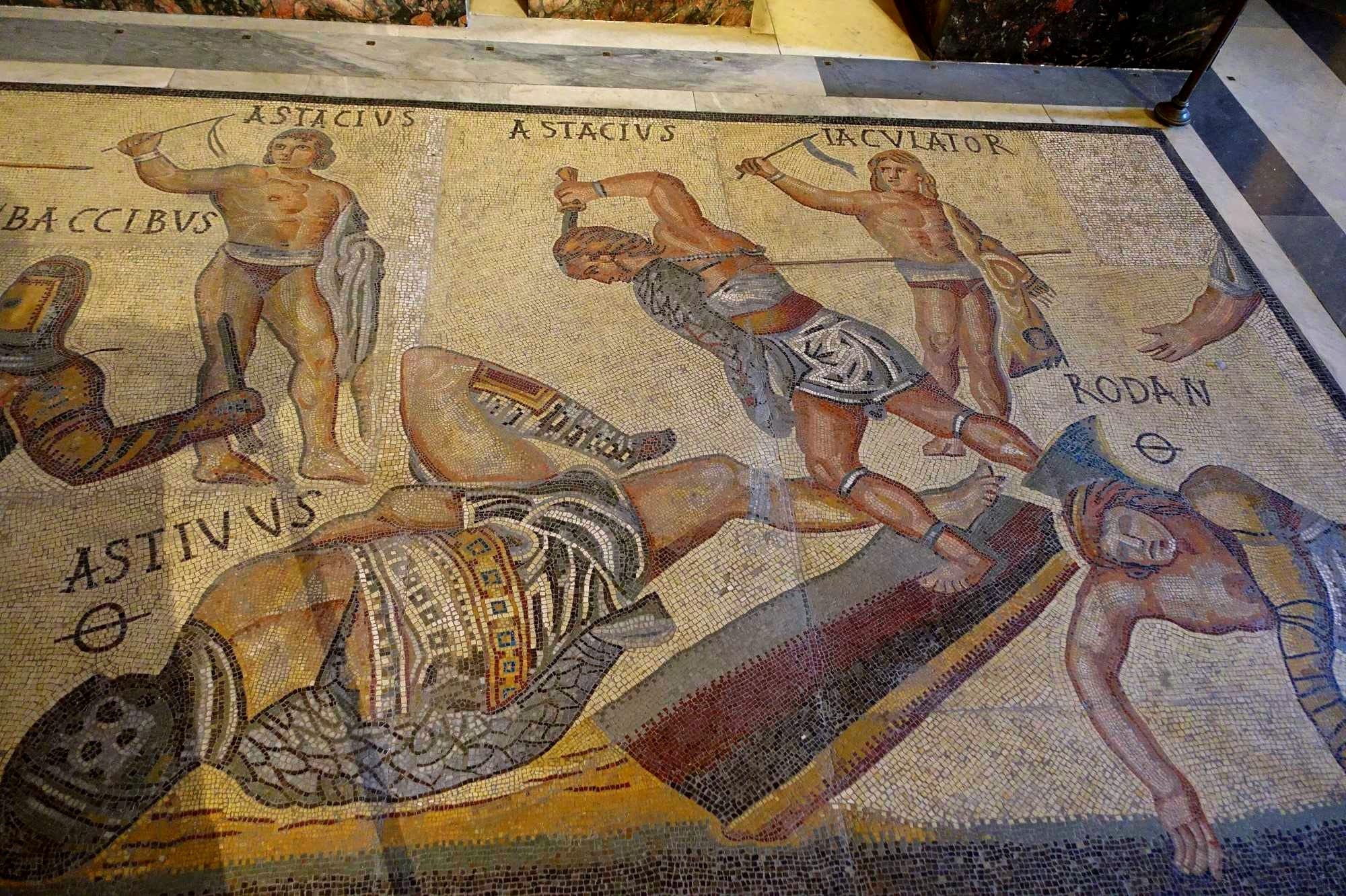  Gladiators, fragment, Roman, 300-400 AD, marble and limestone mosaic - Galleria Borghese - Rome, Italy.