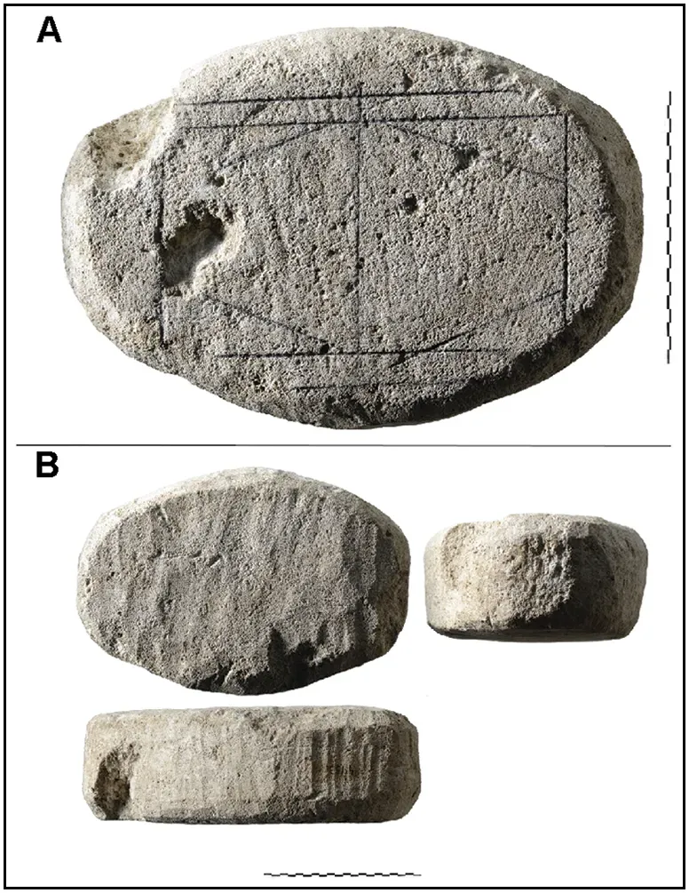 The game board's sides and top surface, with pencil marks outlining the incised lines