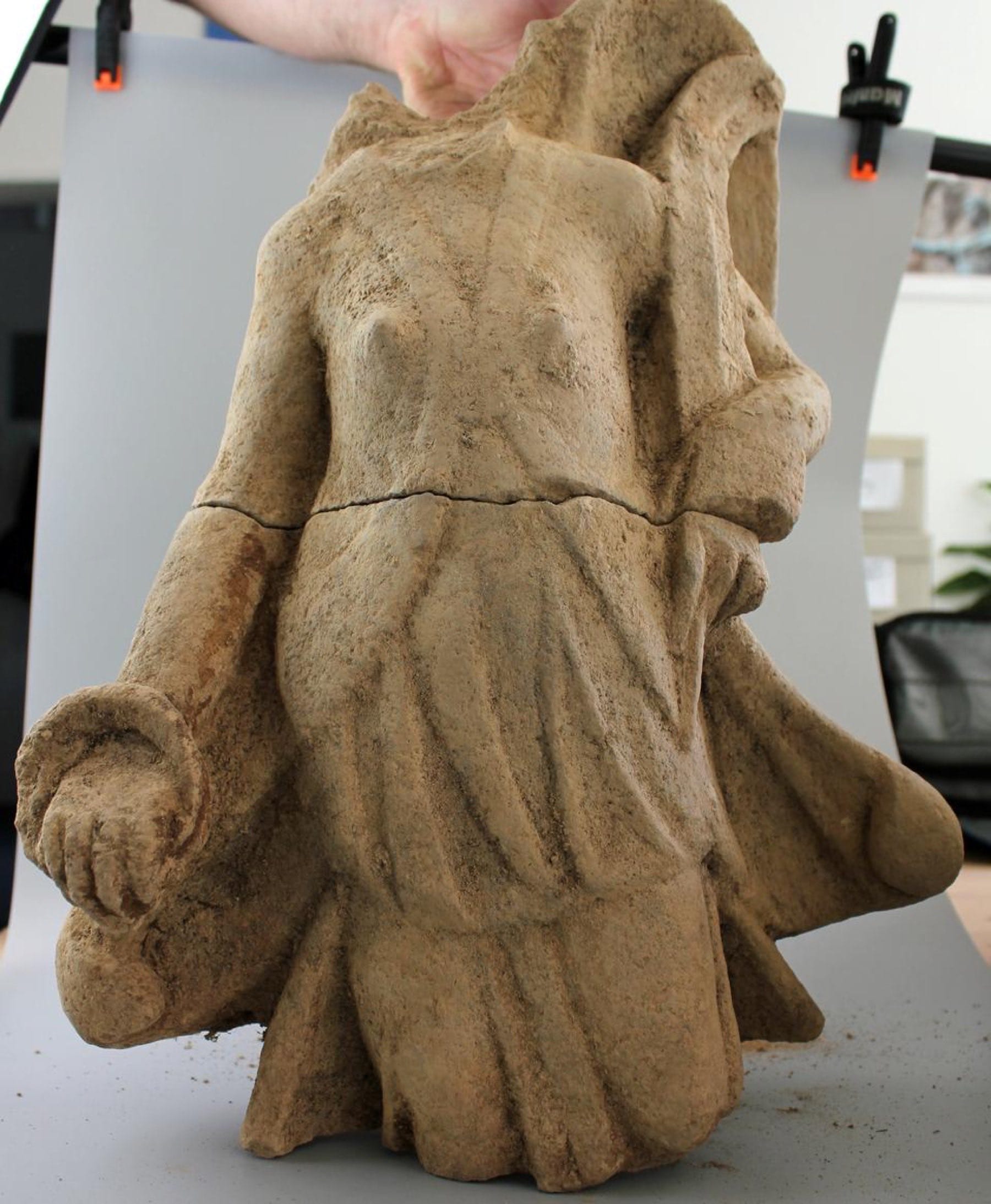 Fragmentary stone torso of a winged Victoria figure from the Kapersburg temple excavation.