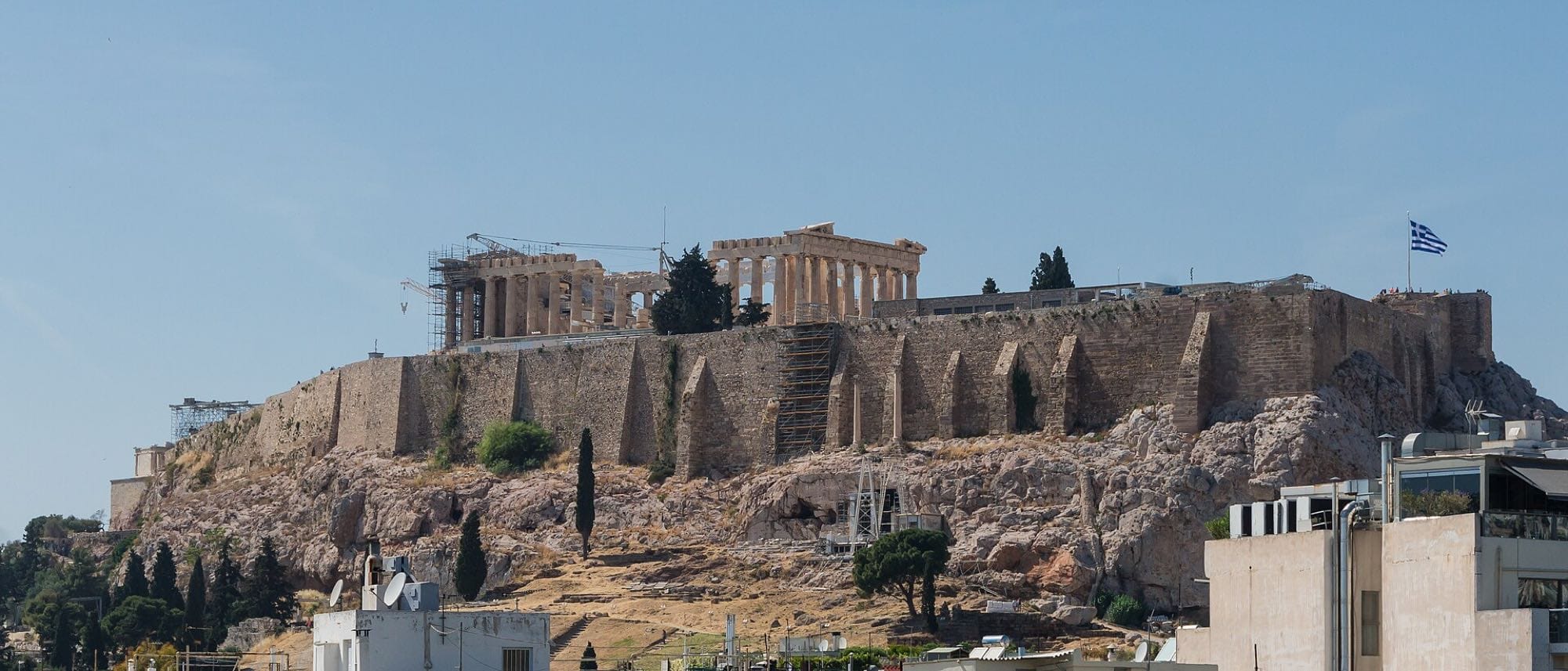 Wide view of the Acropolis and Parthenon above Athens, Greece.