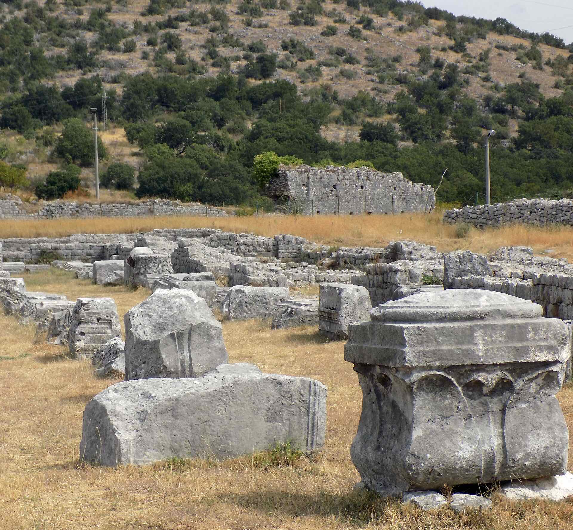 Loose carved stone fragments among the ruins of ancient Doclea near Podgorica, Montenegro.