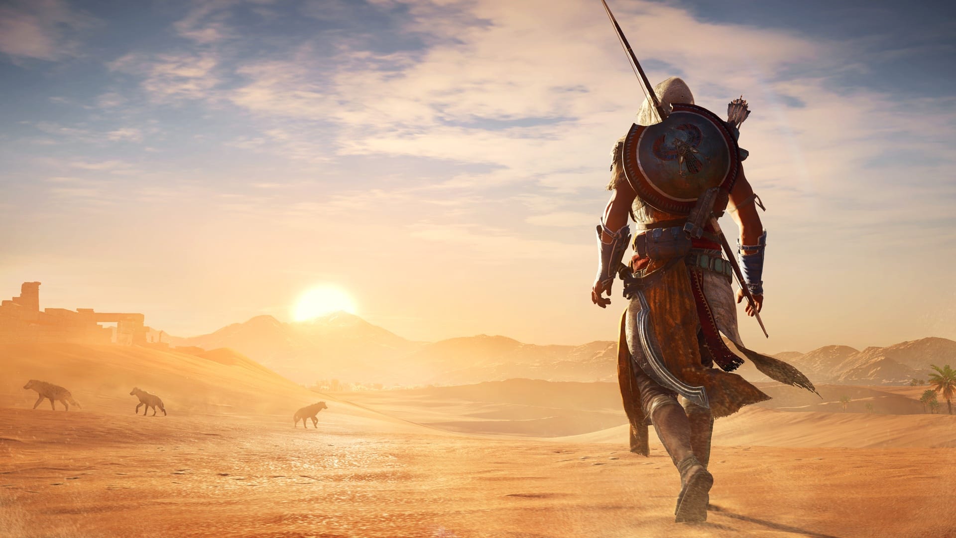 Bayek walks across sunlit desert sand beneath a hazy sky in Assassin’s Creed Origins.