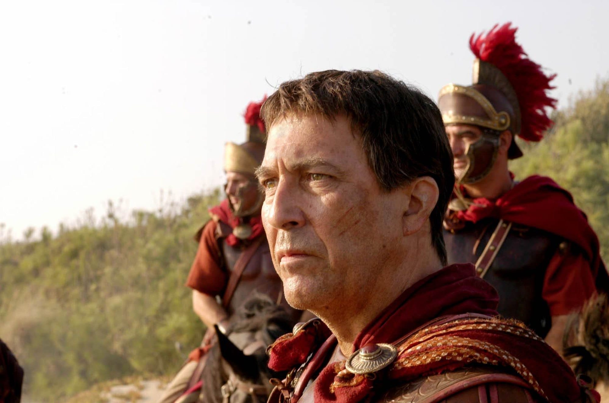 James Purefoy as Mark Antony in Roman military dress, with soldiers behind him.