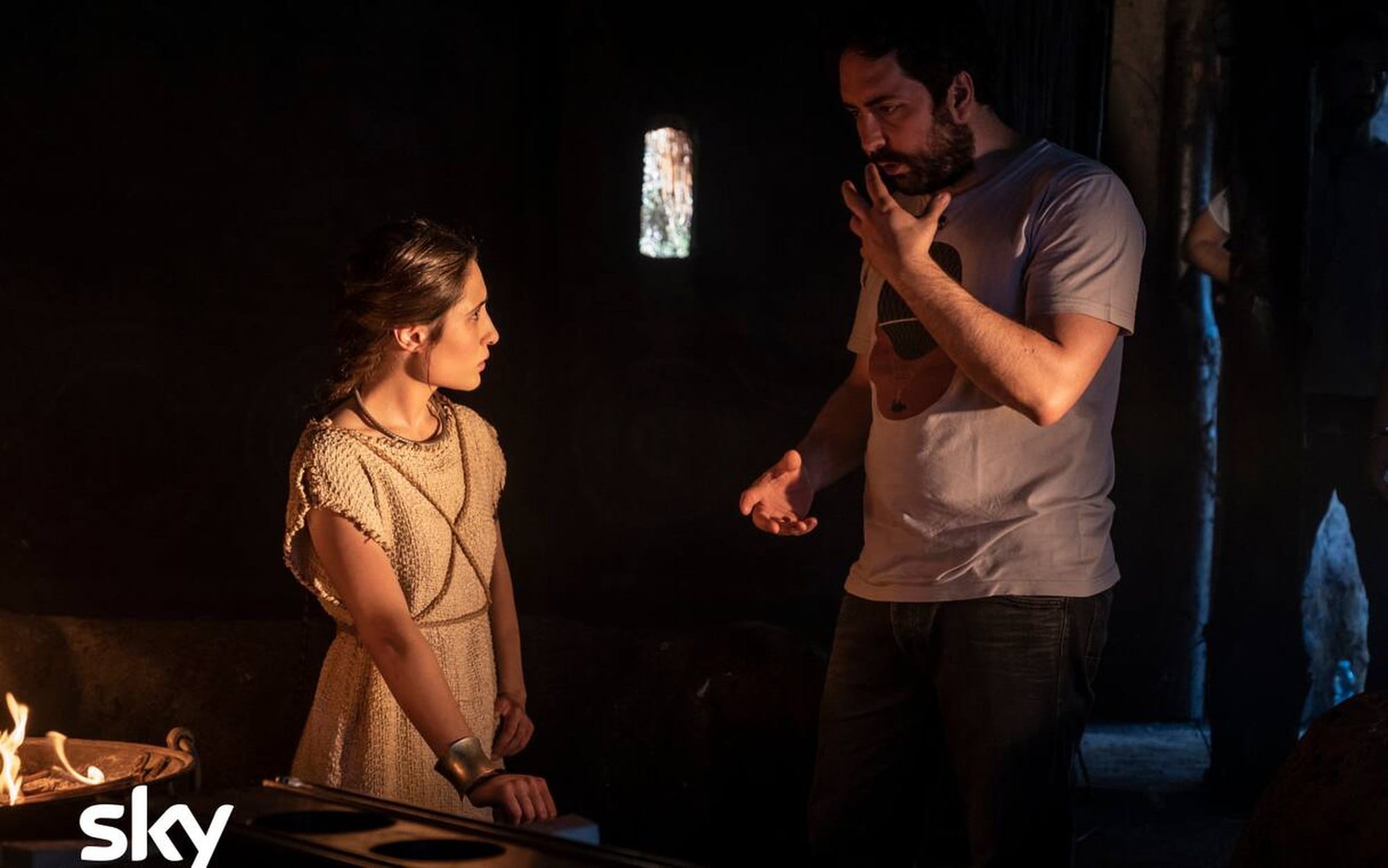 Marianna Fontana in costume as Ilia beside director Matteo Rovere on the Romulus set.