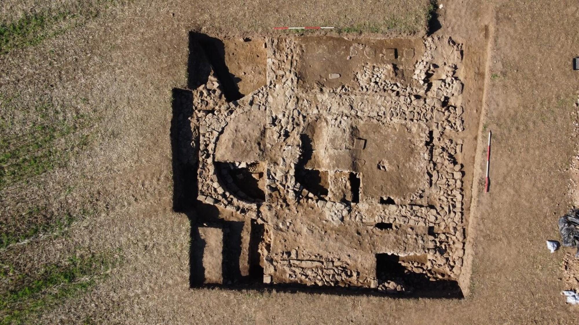 Overhead view of the excavated walls and rounded end of a structure in Trench 1 at Rossett.