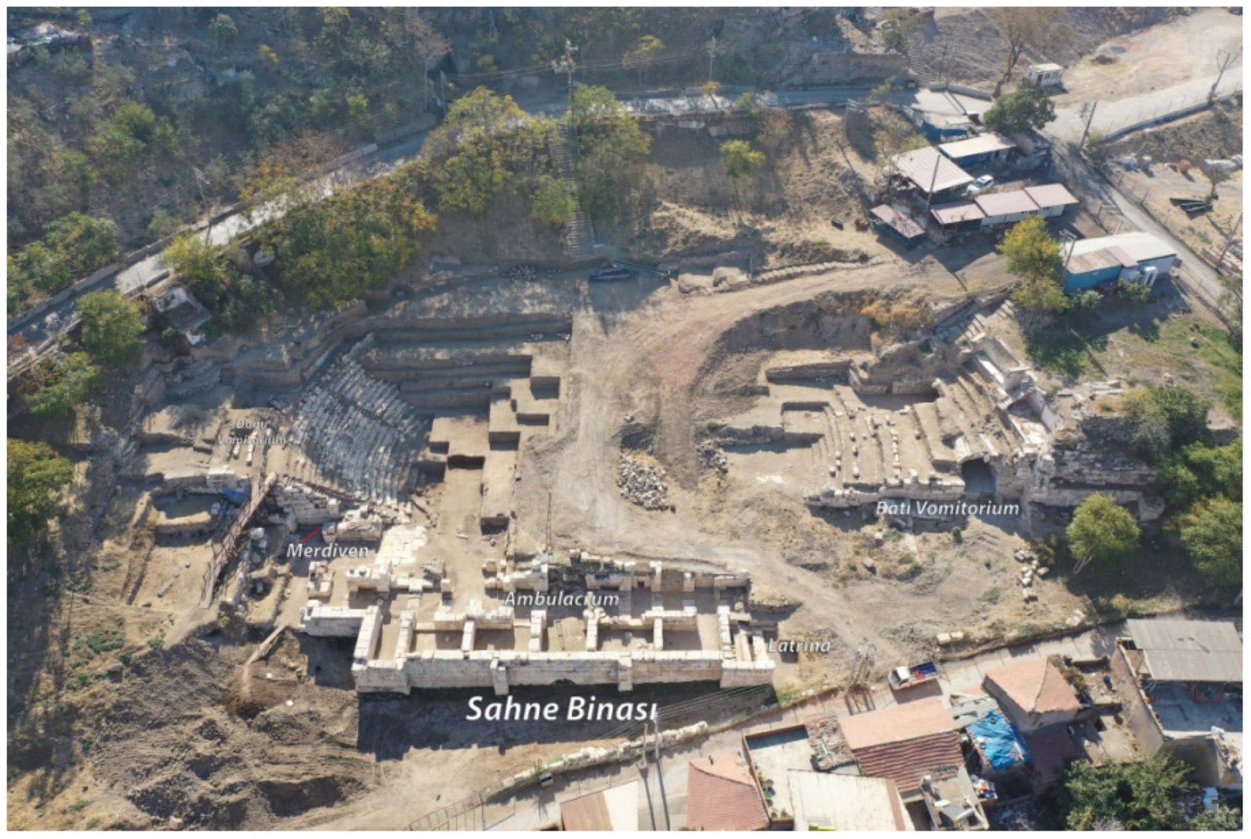 Aerial view of the excavated Smyrna theater with Turkish labels marking the stage building, corridor, latrine, entrances and seating.