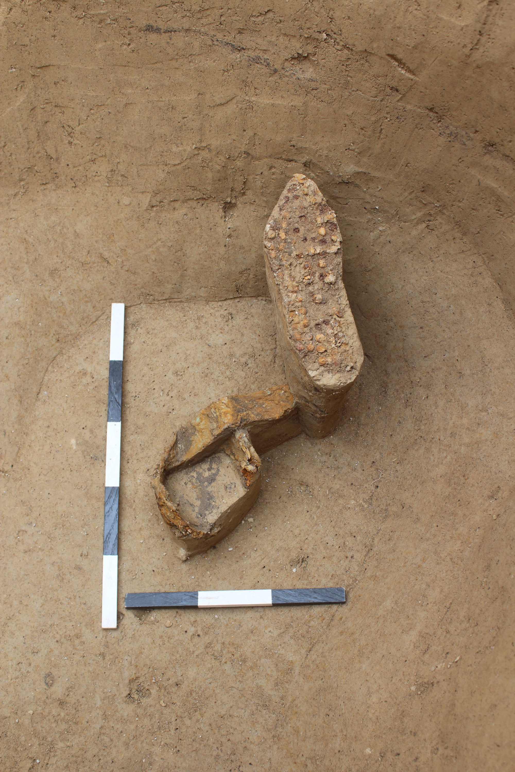 Hobnails of a Roman military shoe next to a fragment of segmented armour in the Šurany excavation.