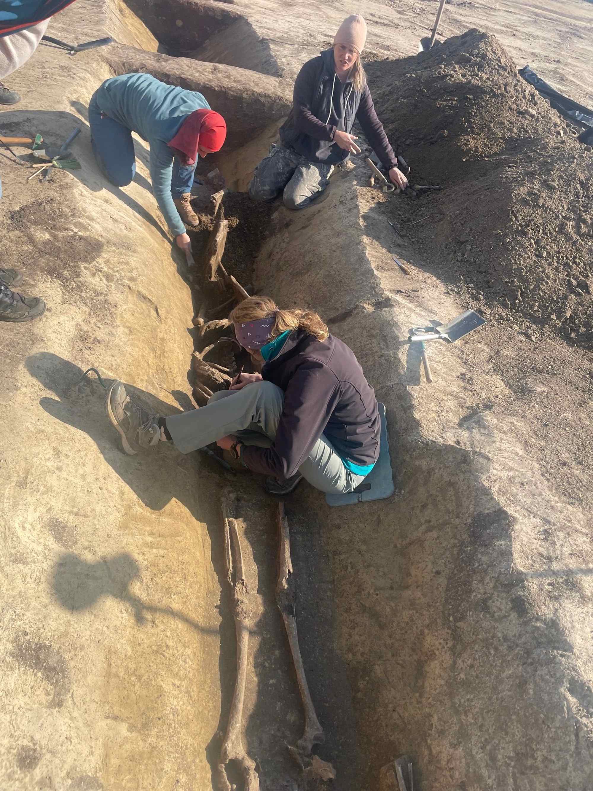 Archaeologists excavating human remains in the northern ditch of the Roman camp near Šurany.
