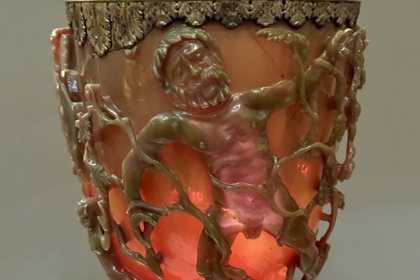 Detail of Lycurgus caught in carved vines on the red-lit Roman Lycurgus Cup.