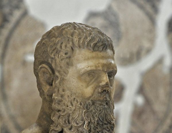 Marble portrait identified as Emperor Pertinax, with short hair and a long divided beard, in the Antakya Archaeology Museum.