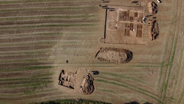 Aerial photograph showing two open excavation trenches in a field at Rossett Roman villa.