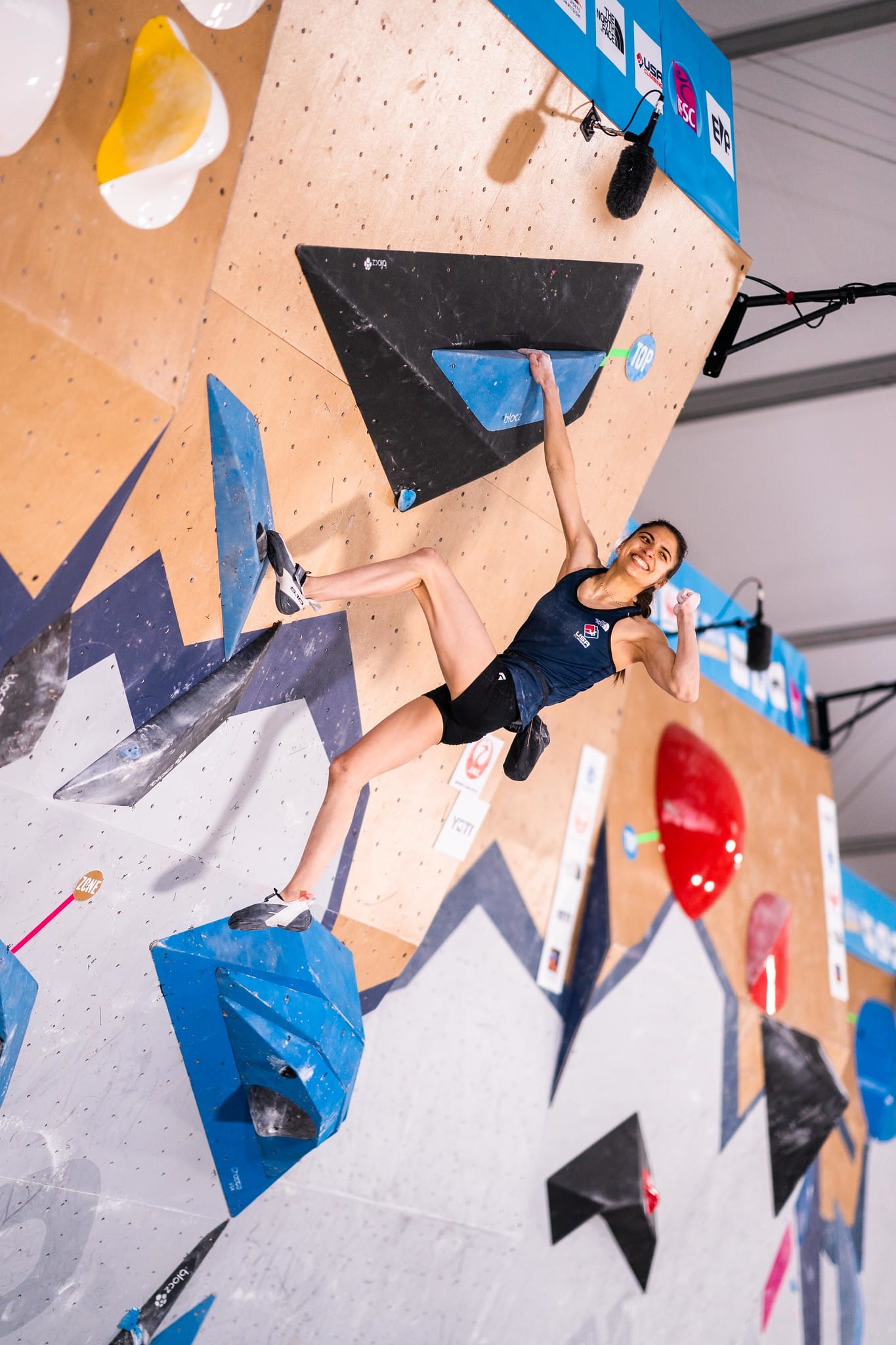 Natalia Grossman celebrating topping a boulder at the 2022 Salt Lake City World Cup