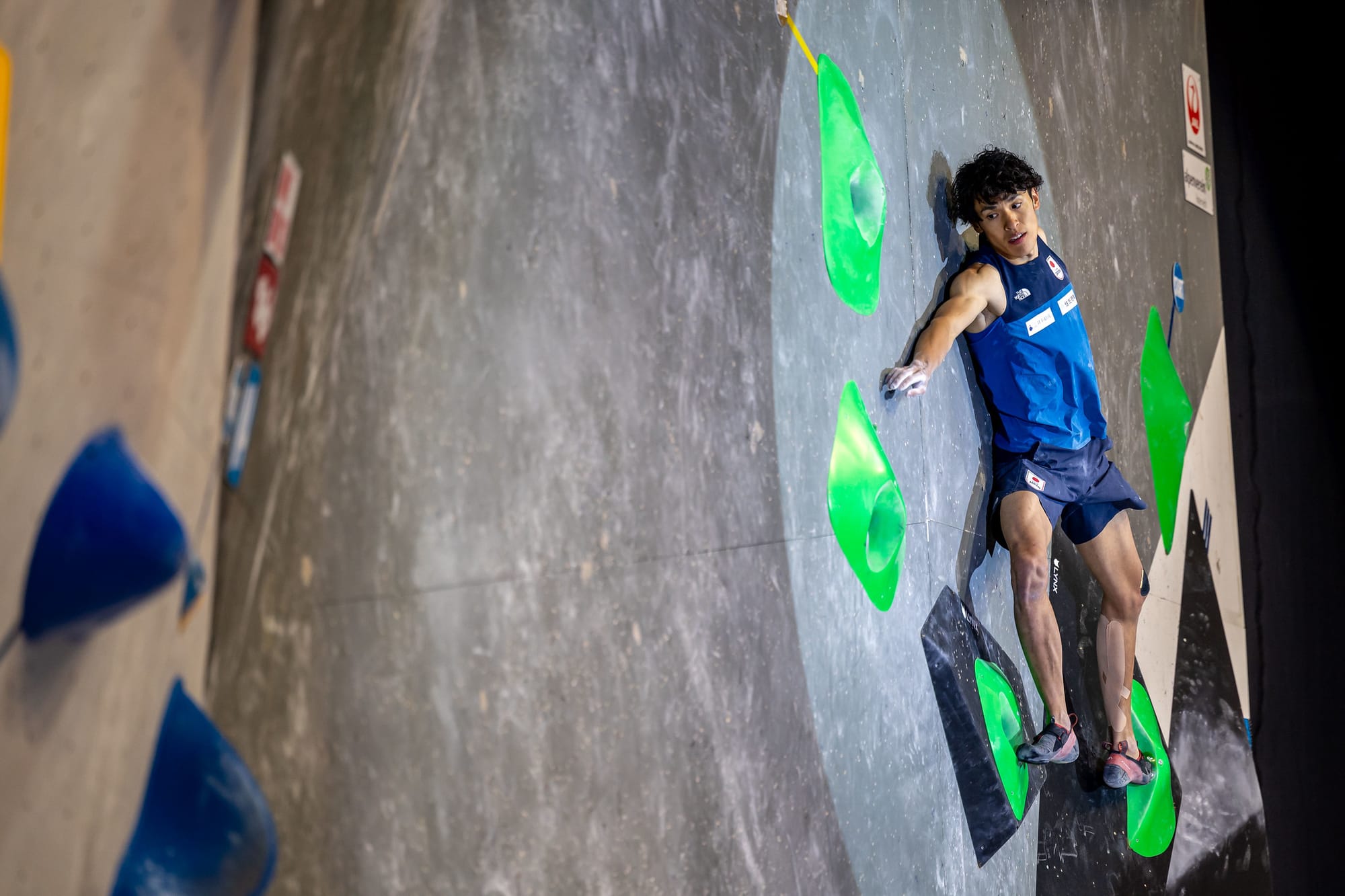 Meichi Narasaki reaching across to the zone hold on Boulder 3