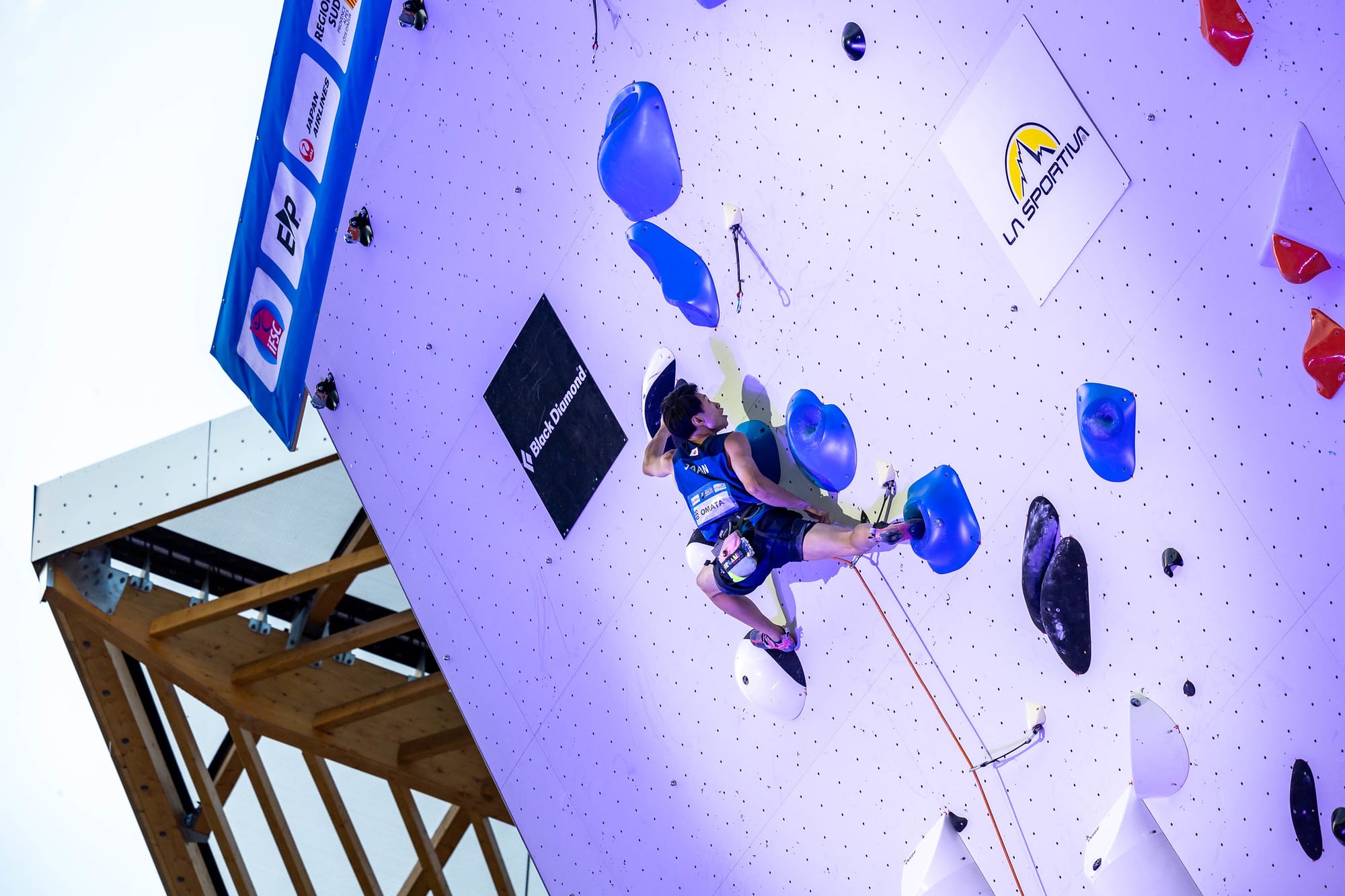 Shion Omata fighting on high up on the headwall in the 2023 World Cup final in Briançon.