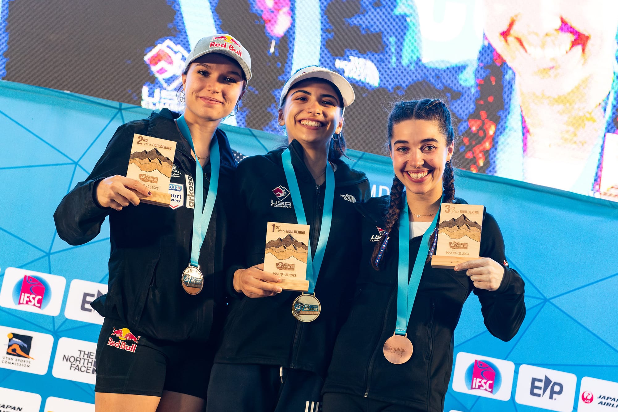 Natalia Grossman, Oriane Bertone, and Brooke Raboutou celebrating with their 2023 SLC World Cup medals