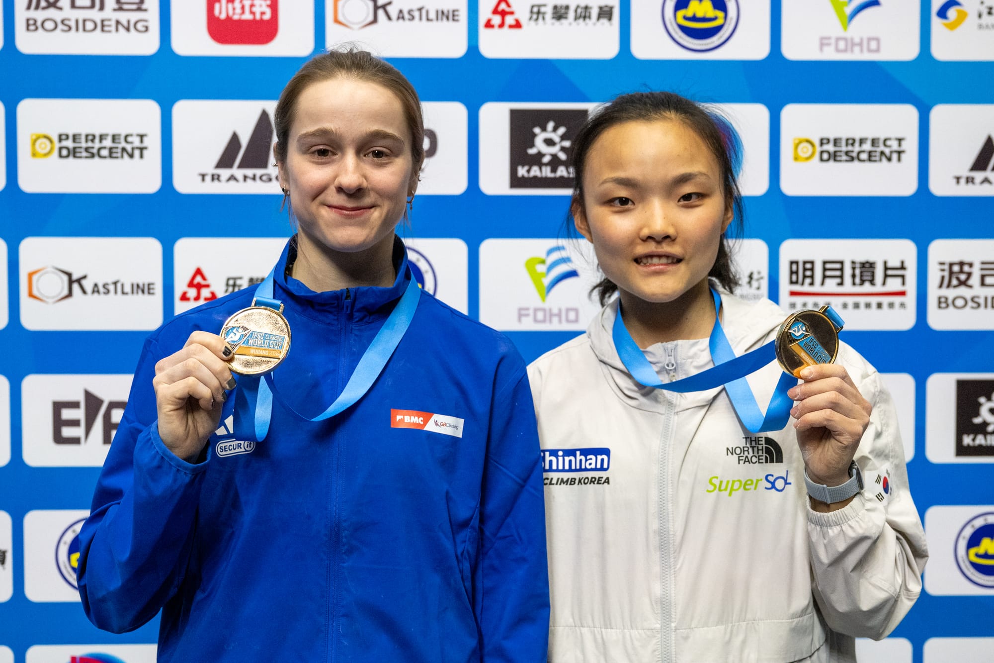 Erin McNeice and Chaehyun Seo with their gold medals
