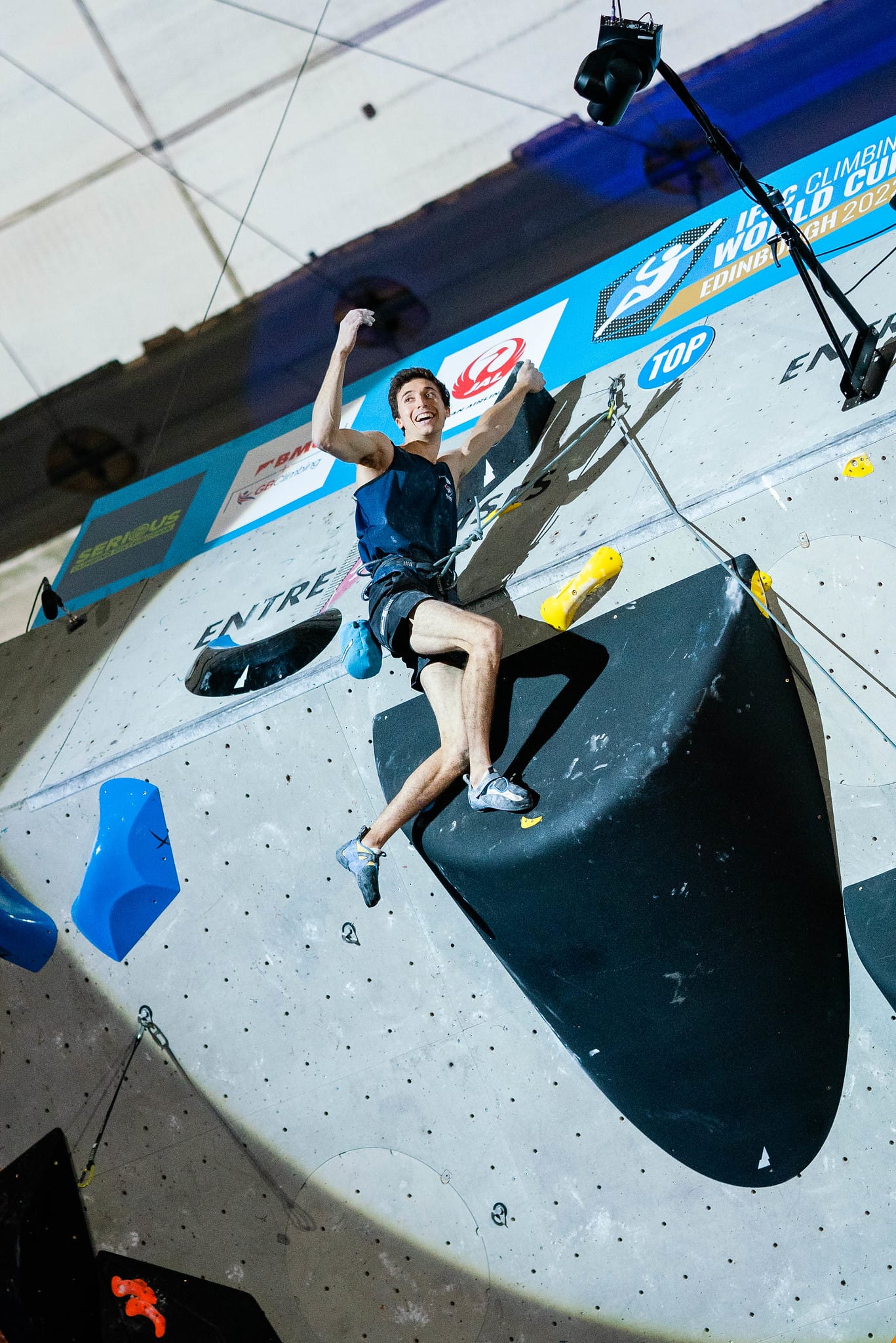 Jesse Grupper celebrating topping out the final route