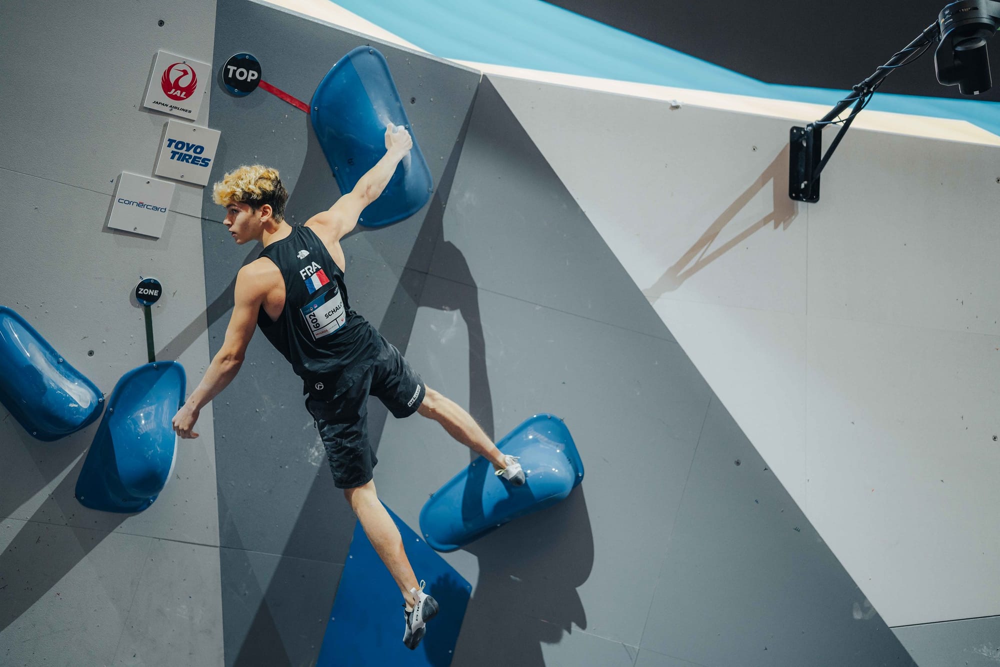 Mejdi Schalck topping a Boulder in the 2023 Boulder World Championship in Bern, Switzerland
