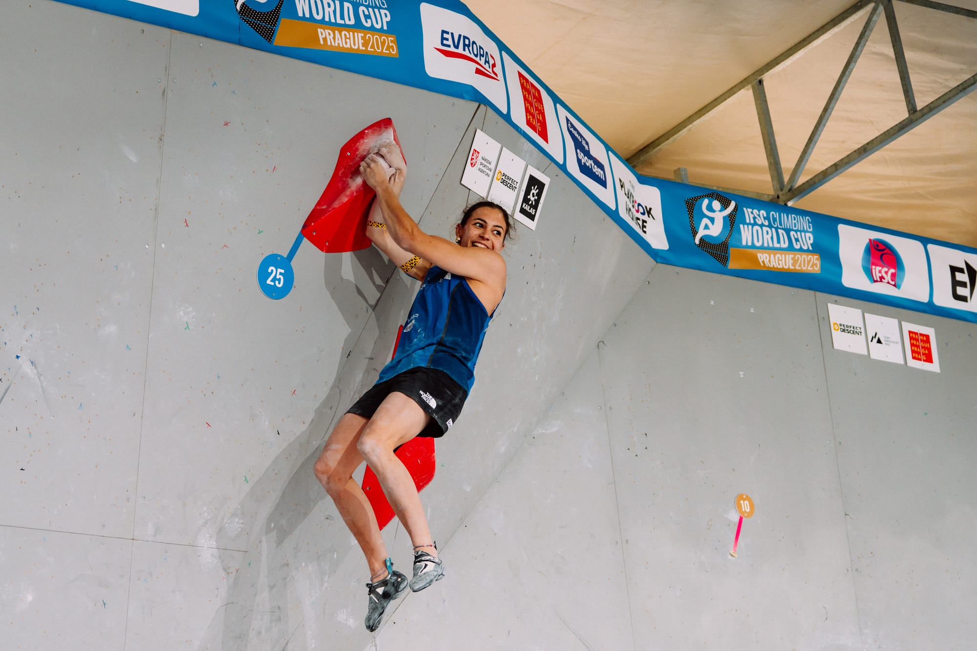 Agathe Calliet celebrating at the top of W3 in the semi-final.