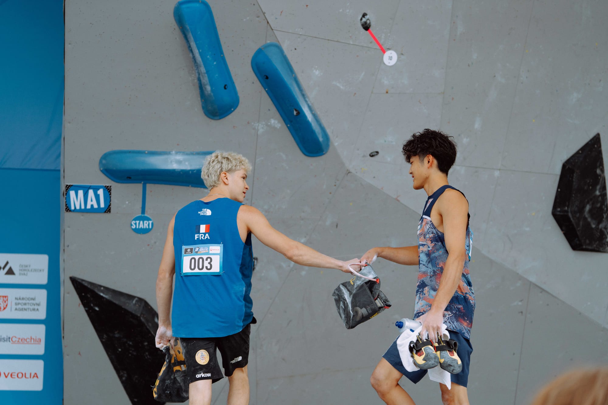 Sorato Anraku and Mejdi Schalck fist bumping in the Prague qualification round